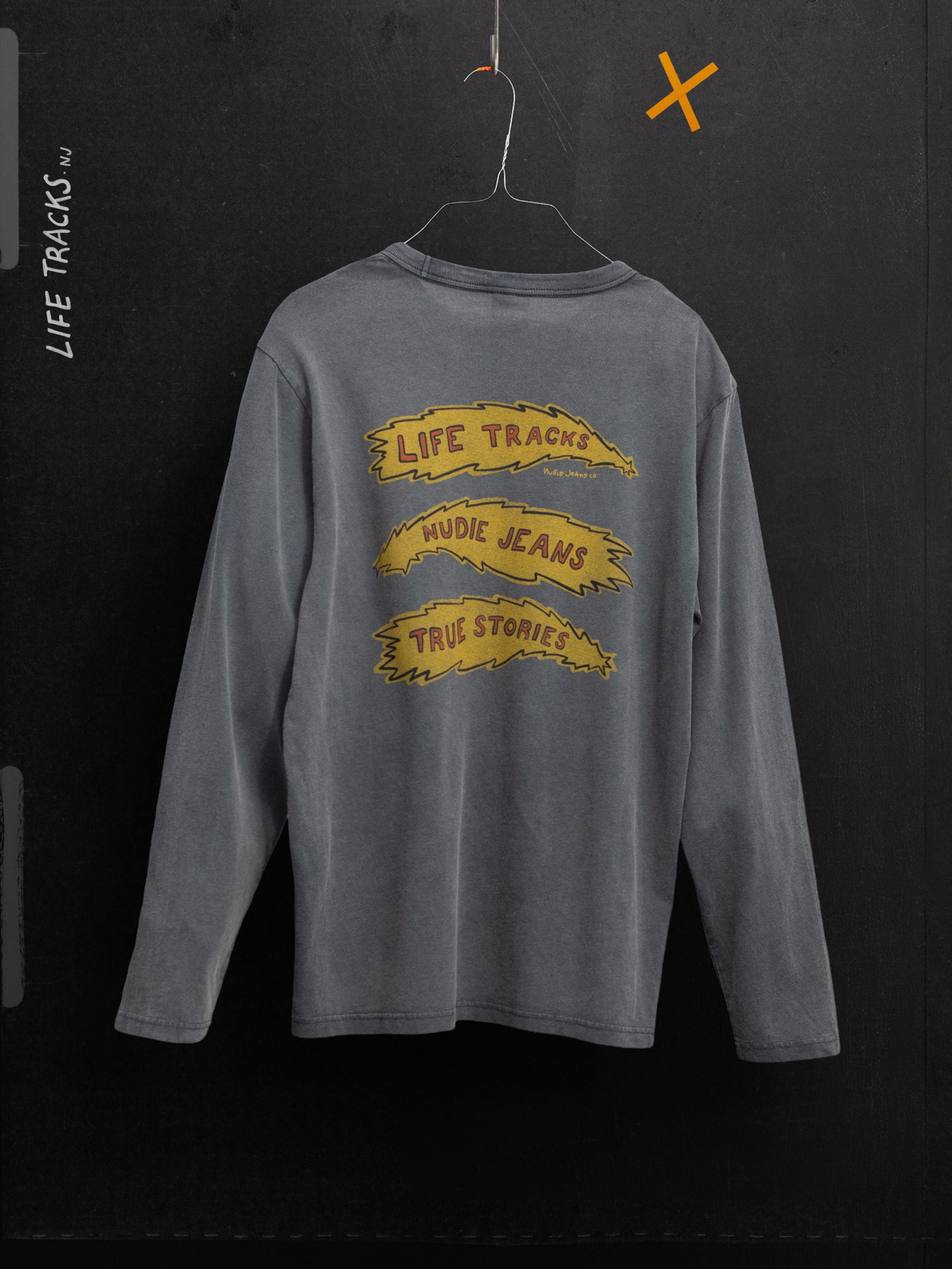 Nudie Jeans Rudi LS T-Shirt Life Tracks II Antracite, faded organic cotton tee with yellow graphic prints on the back.