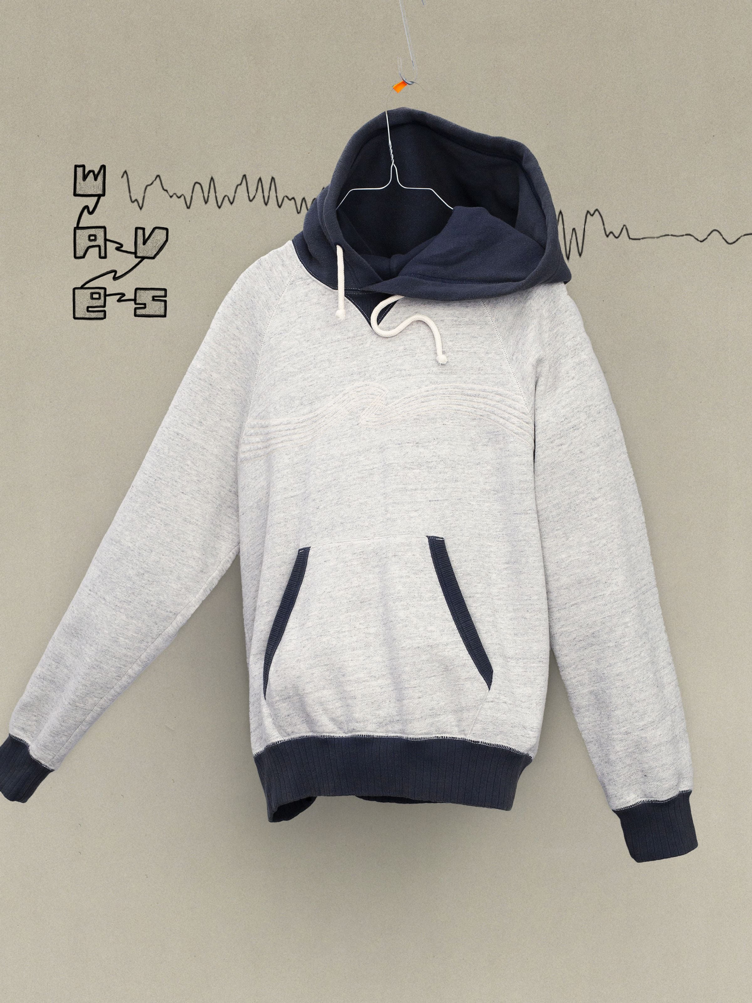 Nudie Jeans Gunde Hoodie Embo Wave in Greymelange organic cotton, featuring a contrast navy hood and wave embroidery.