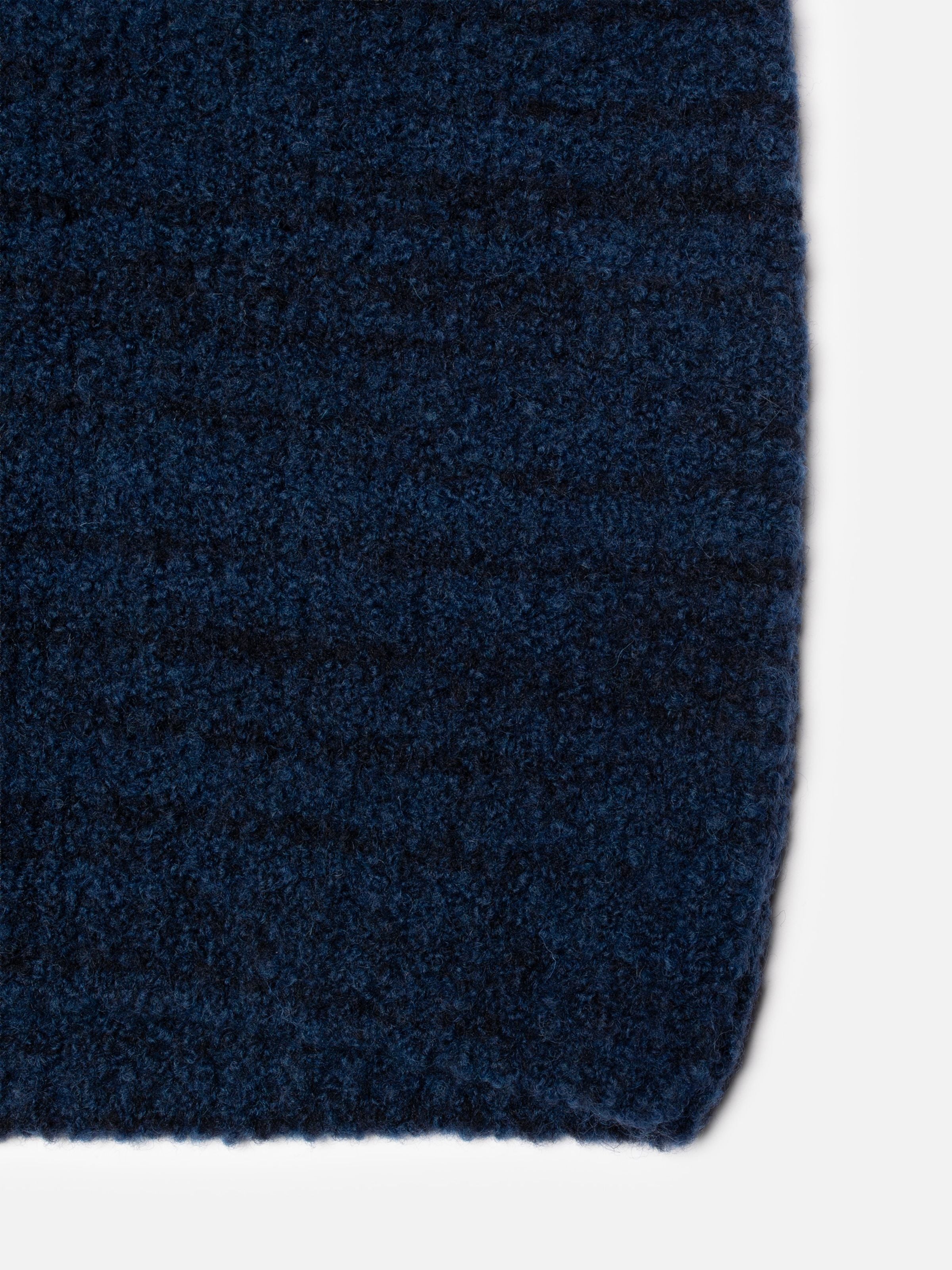 Nudie Jeans Gurra Boucle Sweater Multi, close-up of the textured navy blue organic wool blend fabric.