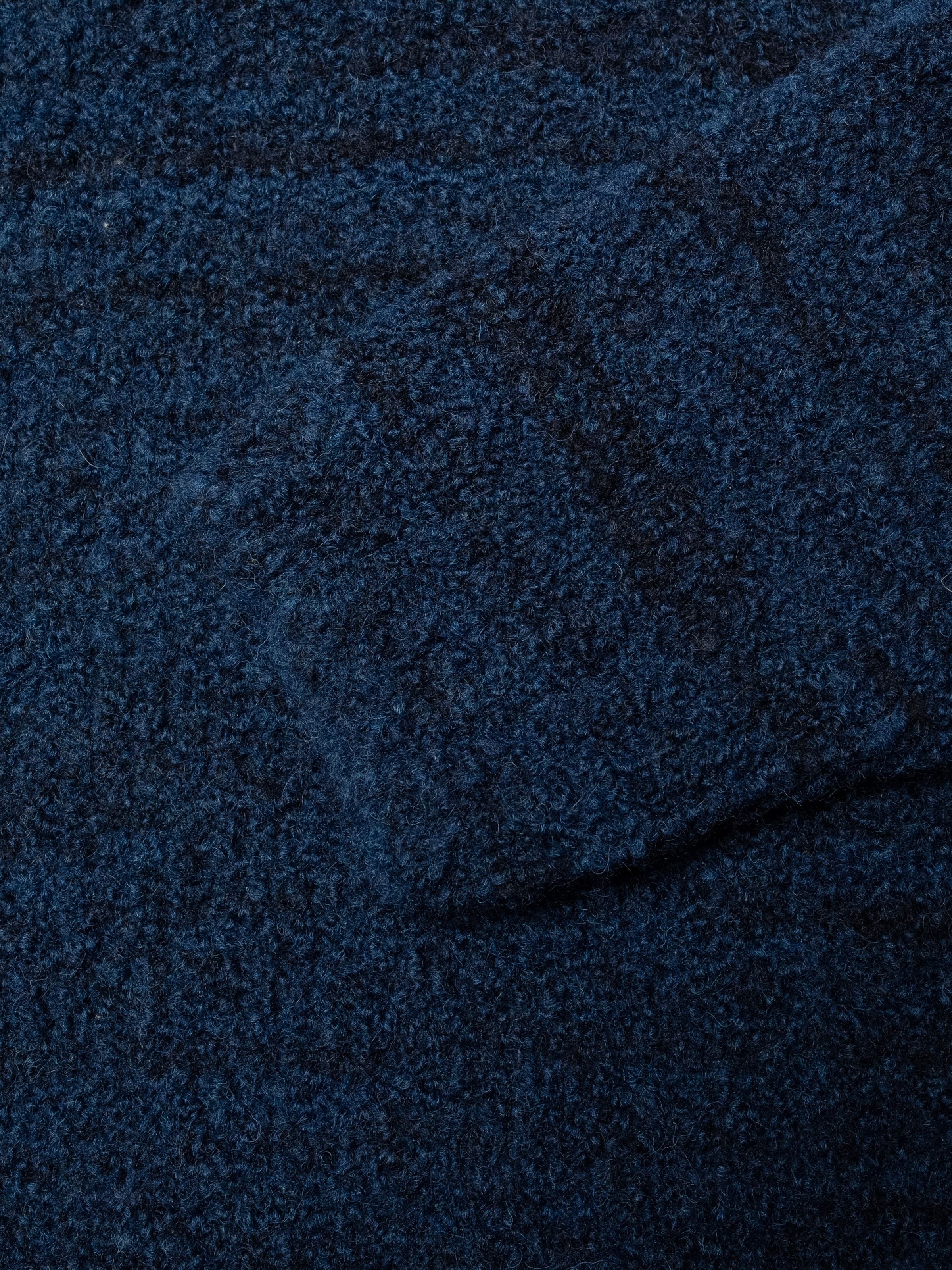 Nudie Jeans Gurra Boucle Sweater Multi, close-up of the textured navy blue organic wool blend fabric.