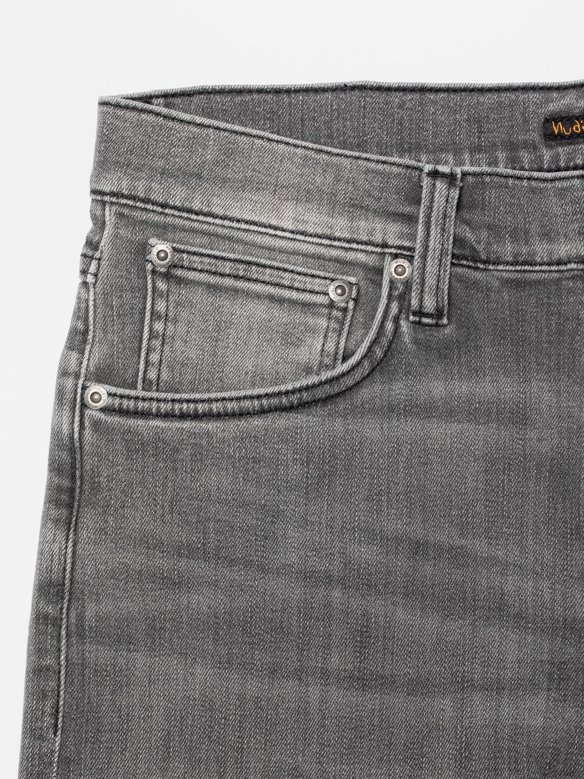Nudie Jeans Lean Dean Grey Asphalt, close-up of the front pocket and silver rivets on grey organic cotton stretch denim.