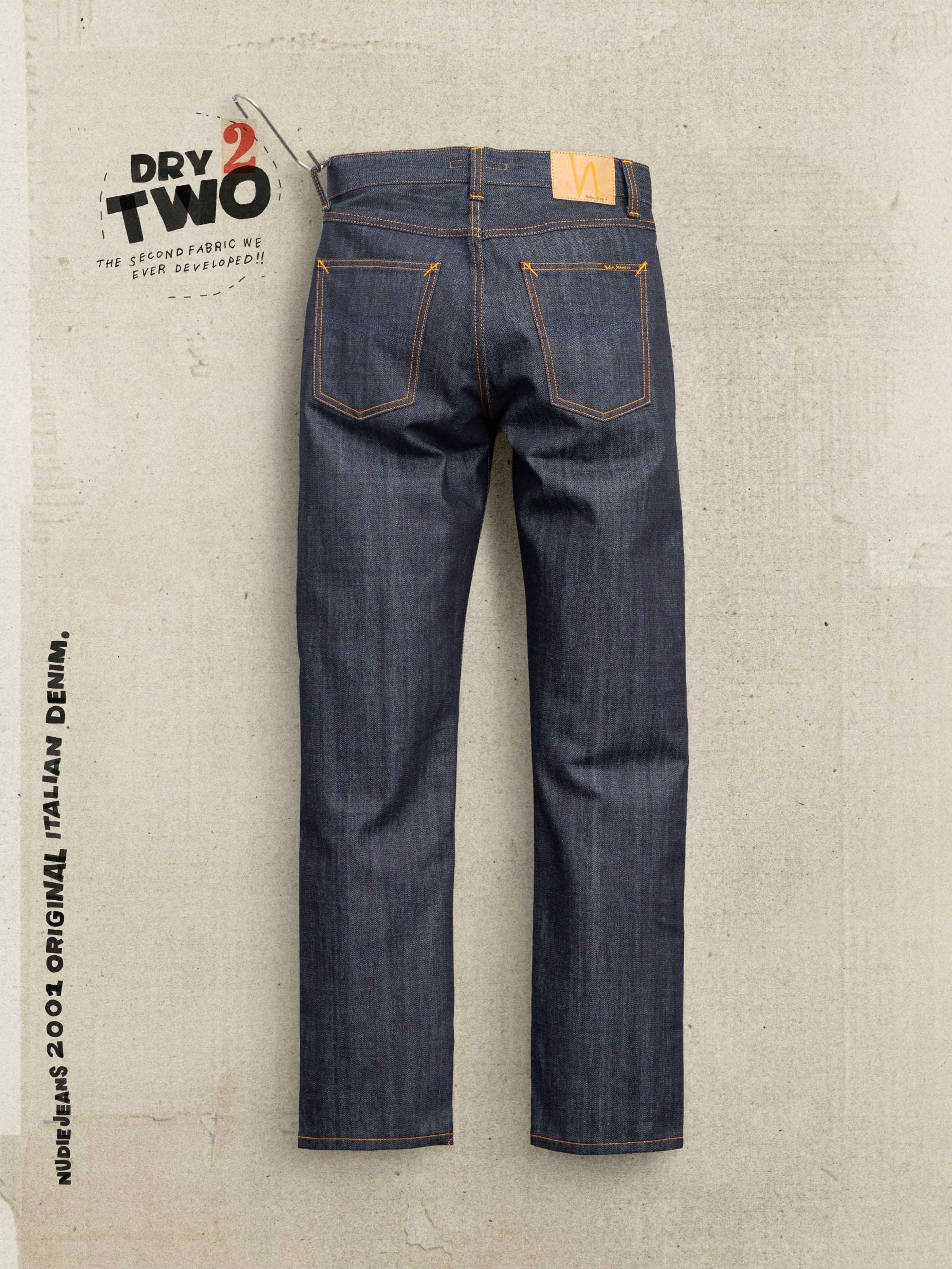 Nudie Jeans Gritty Jackson Blue Dry Two, back view of regular fit jeans in rigid organic cotton denim with orange thread.