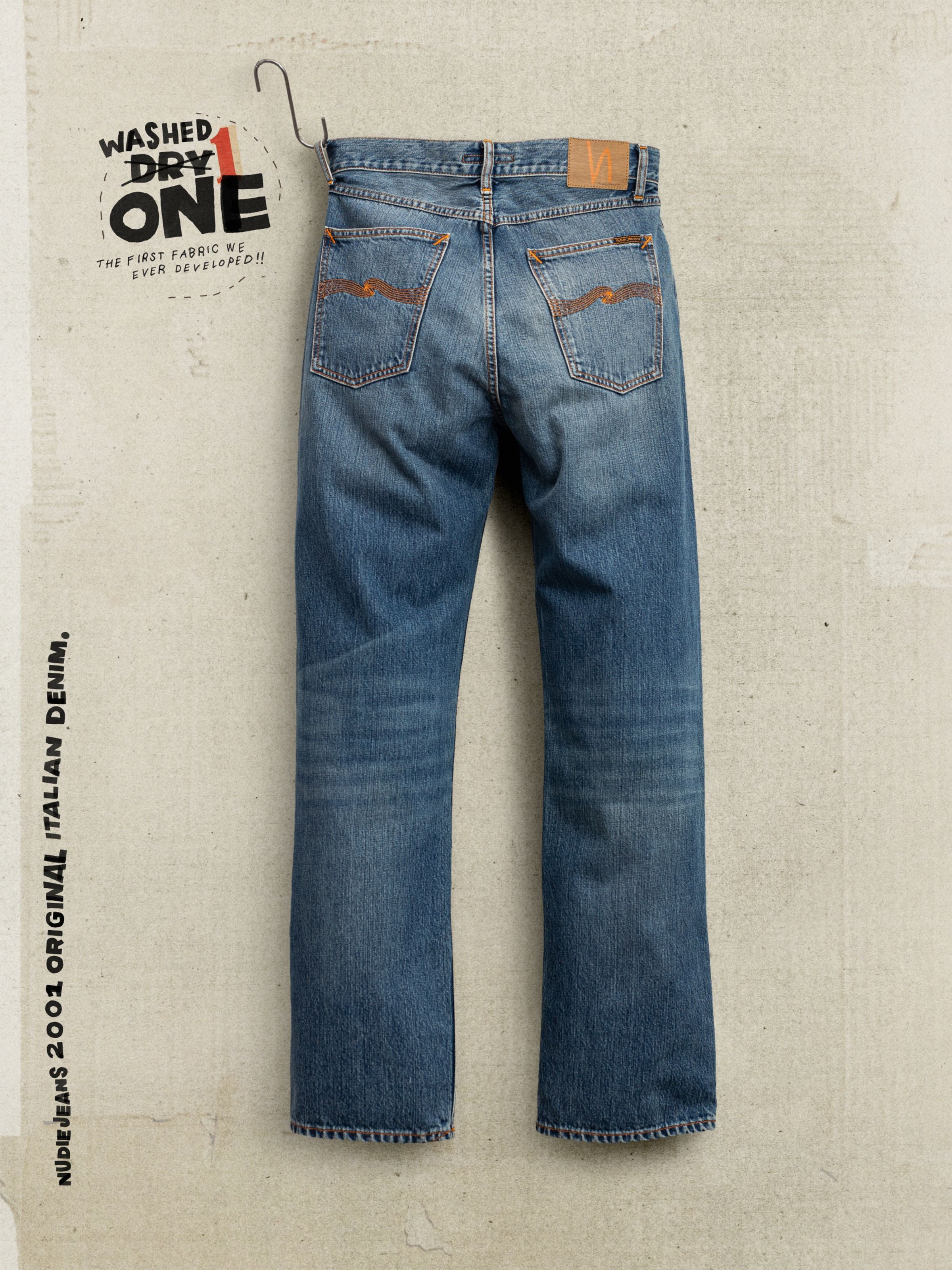 Nudie Jeans Tuff Tony Quiet Gold, loose fit organic cotton jeans in mid blue wash featuring orange back pocket embroidery.
