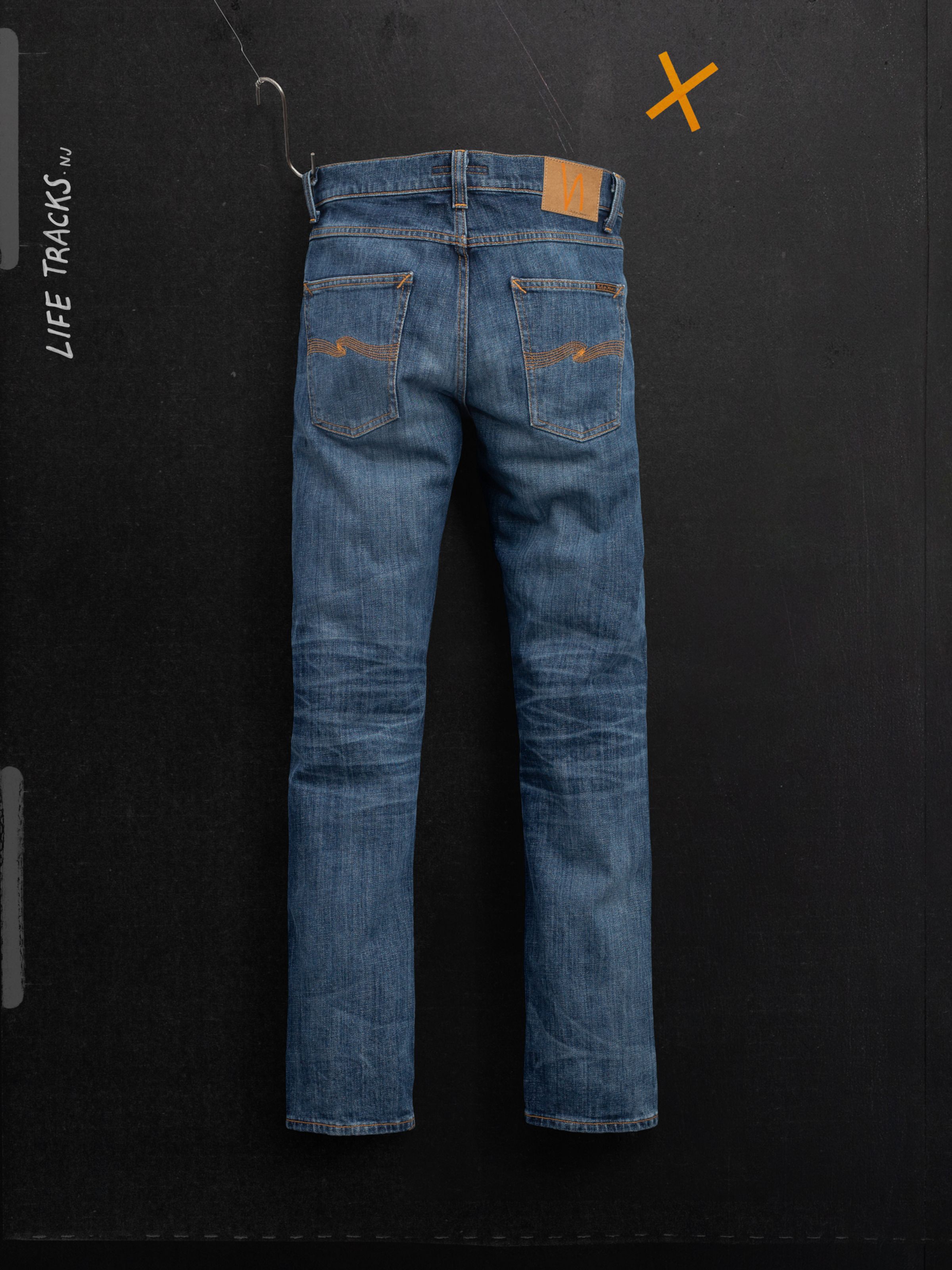 Nudie Jeans Lean Dean Echo Tracks, slim tapered fit jeans in washed organic cotton denim with honeycomb fades, back view.