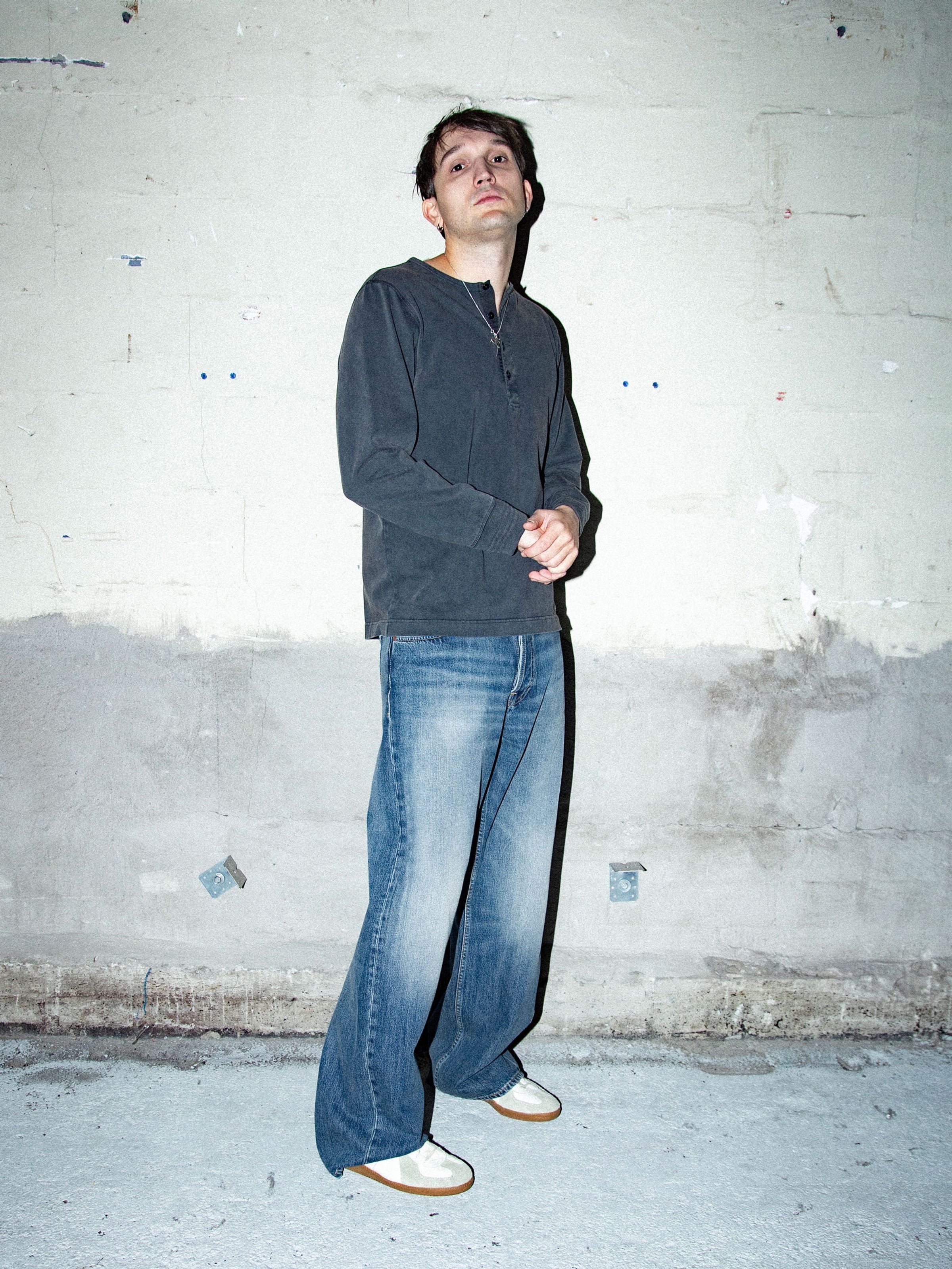 Nudie Jeans Loud Larry Gravel Stone, loose-fit wide-leg jeans in mid-blue organic cotton, shown on a model.