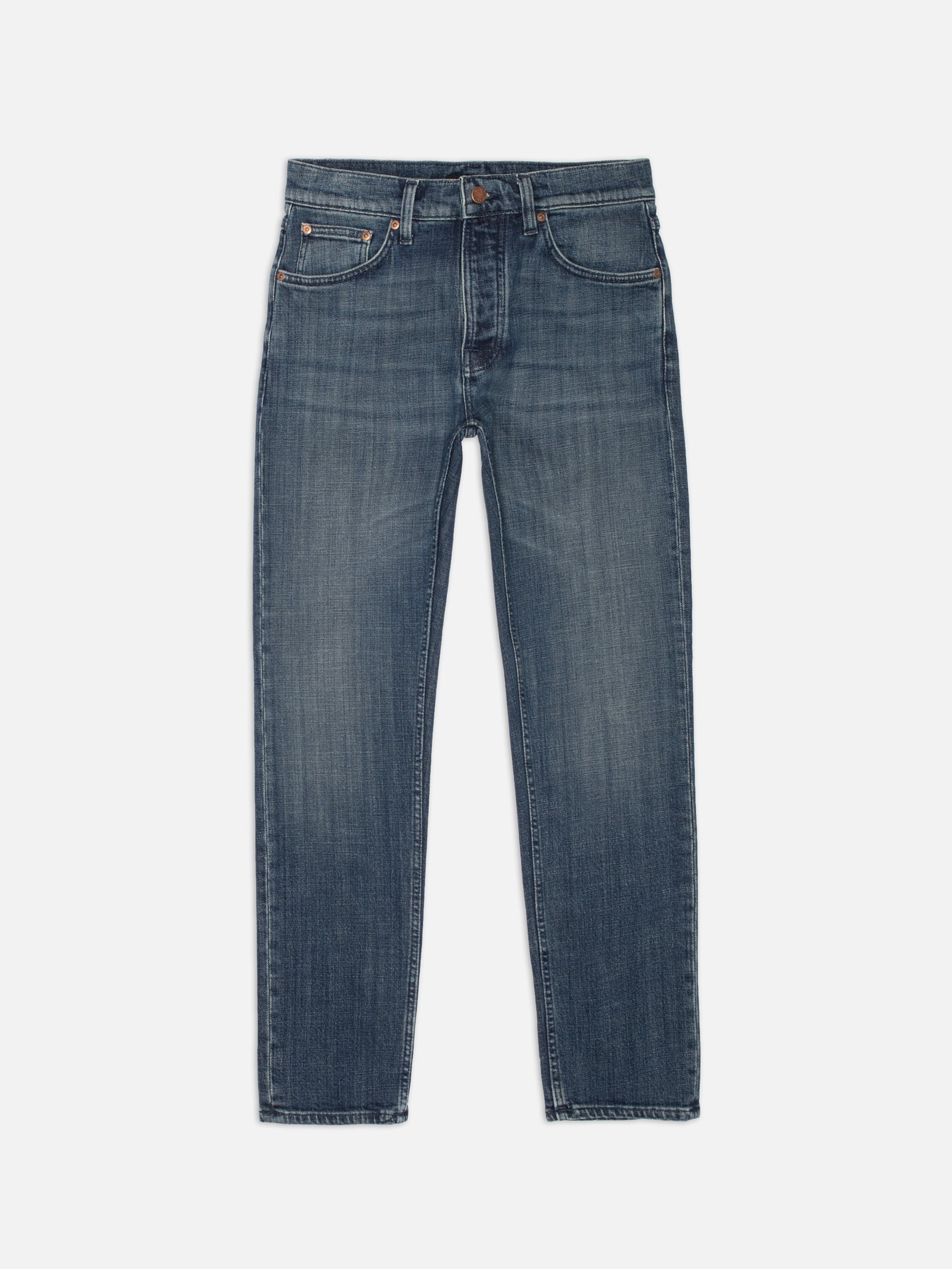 Nudie Jeans Solid Ollie Epic Ink, slim-fit straight-leg jeans in dark blue organic cotton, shown laid flat.