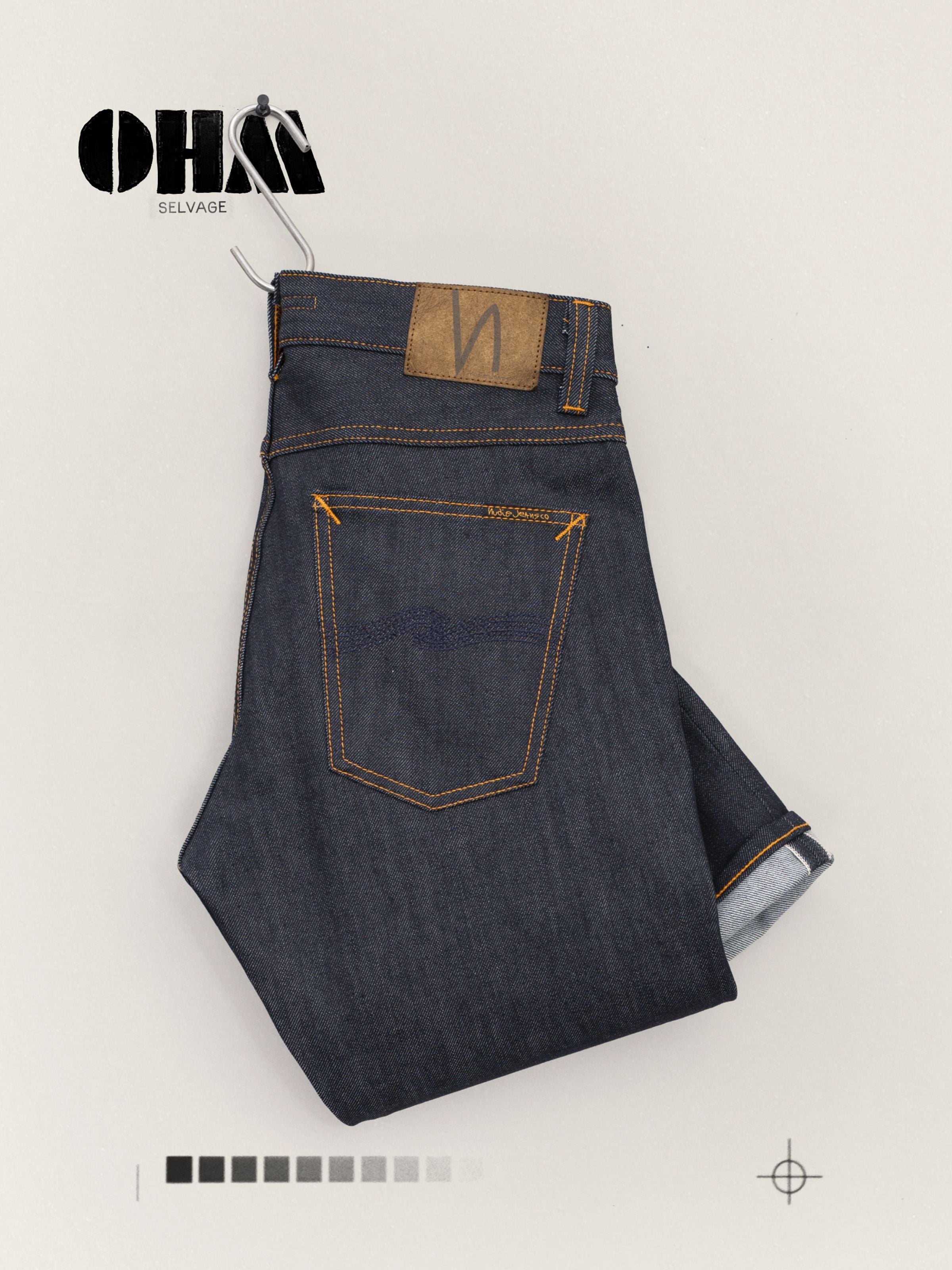 Nudie Jeans Lean Dean Dry Ohm Selvage, deep blue organic cotton selvedge jeans, shown folded and hung.
