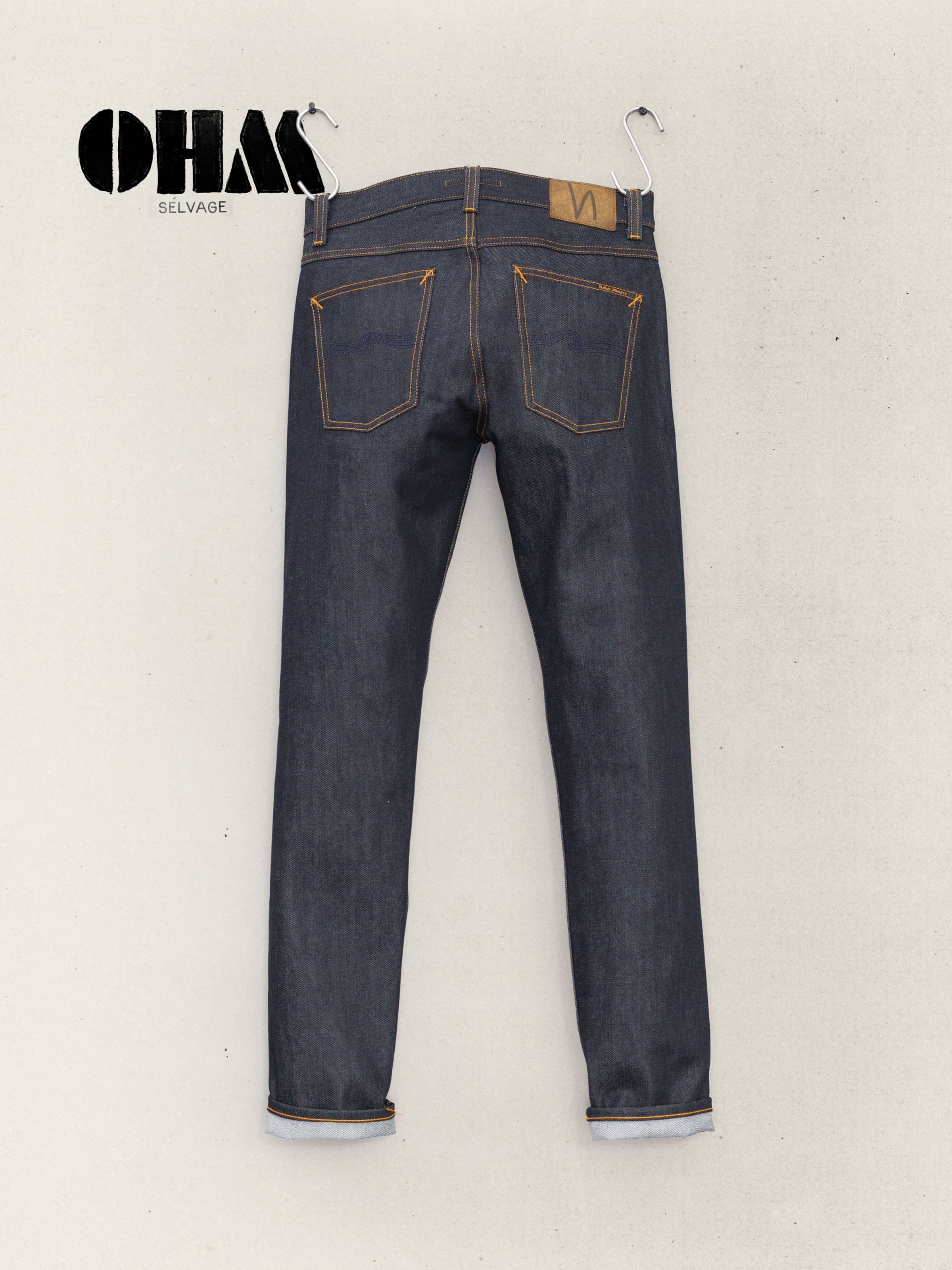 Nudie Jeans Lean Dean Dry Ohm Selvage, back view of slim tapered organic cotton selvedge jeans in deep indigo blue.