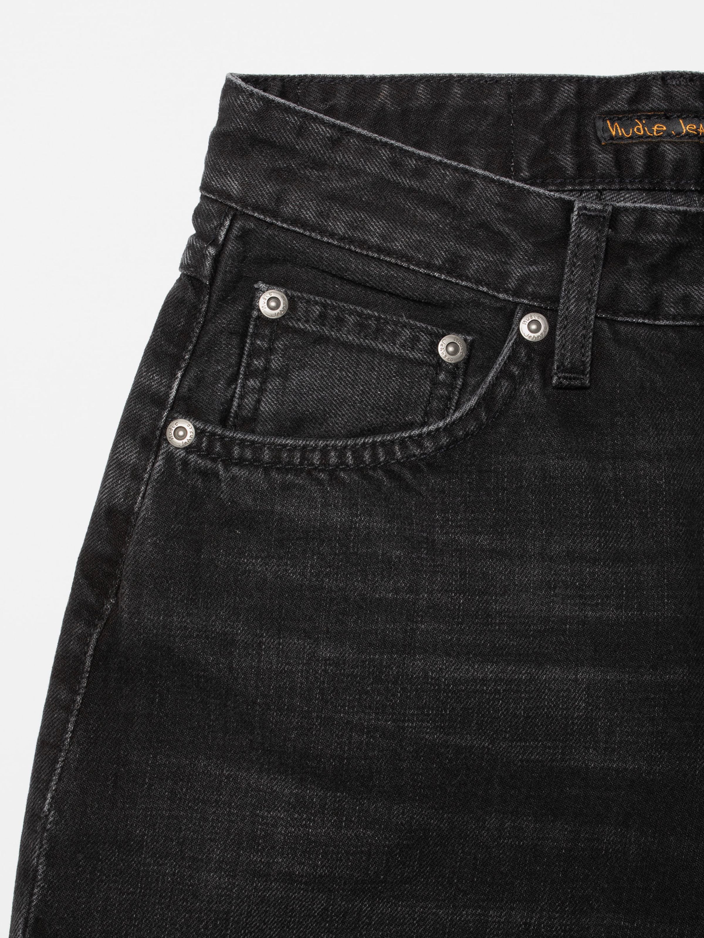 Nudie Jeans Clean Eileen Night Dune, close-up of the front pocket and antique silver trims on black organic cotton denim.