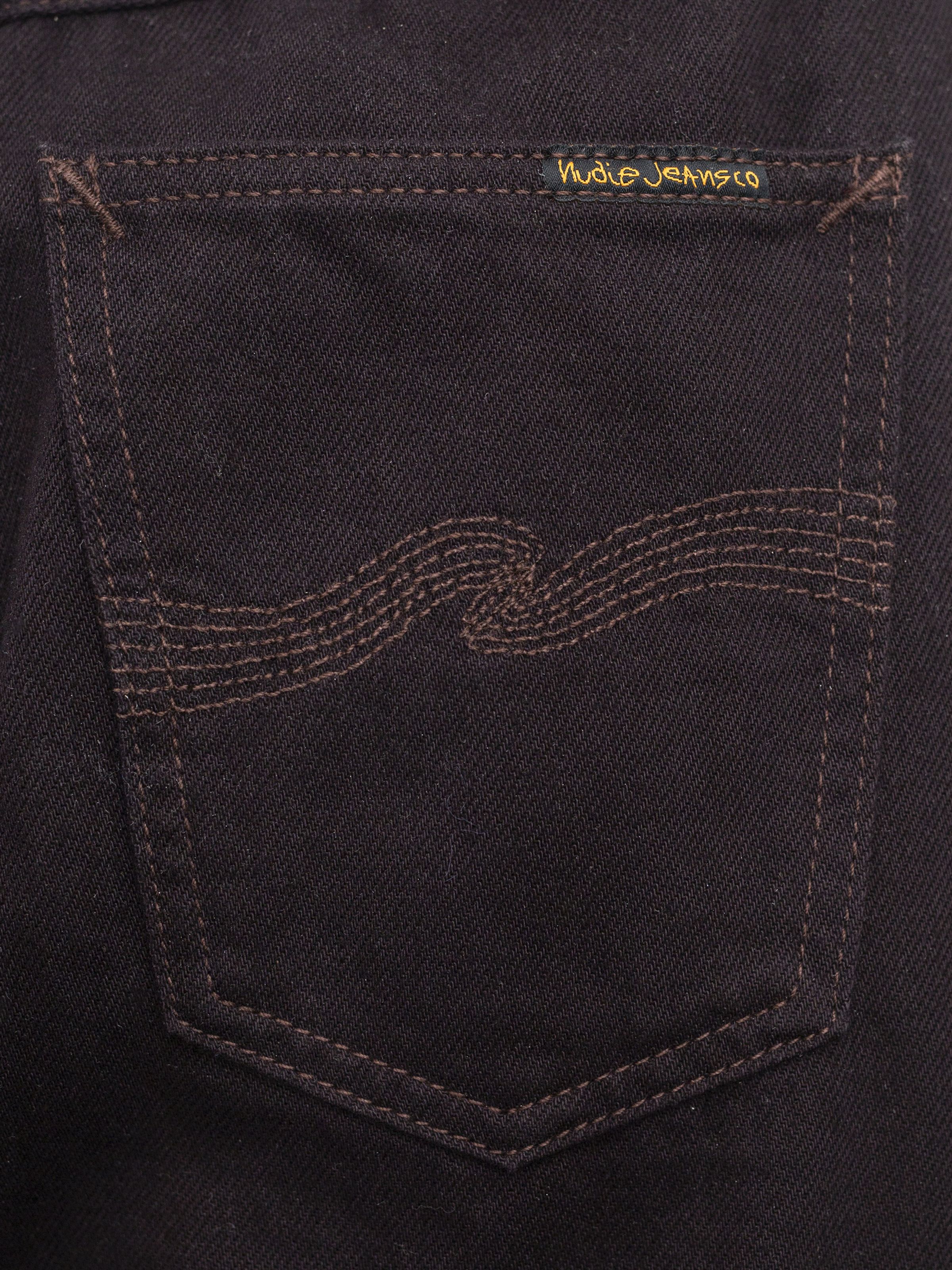 Nudie Jeans Sonic Sue Everbrown back pocket detail, featuring tonal embroidery on dark brown organic cotton rigid denim.