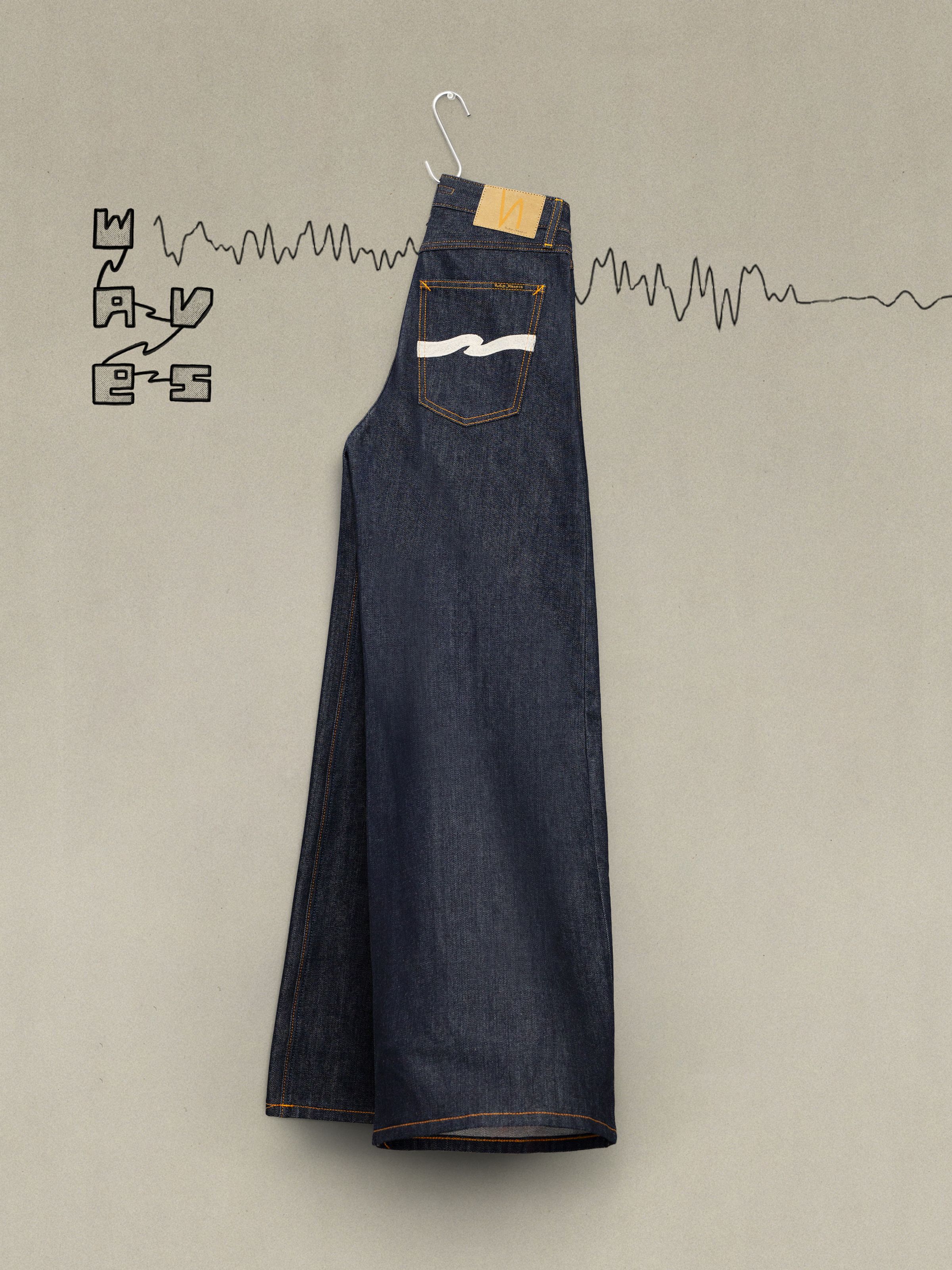 Nudie Jeans Sonic Sue Dry Ecru Waves, women's wide-leg jeans in rigid indigo organic cotton with ecru back pocket embroidery.