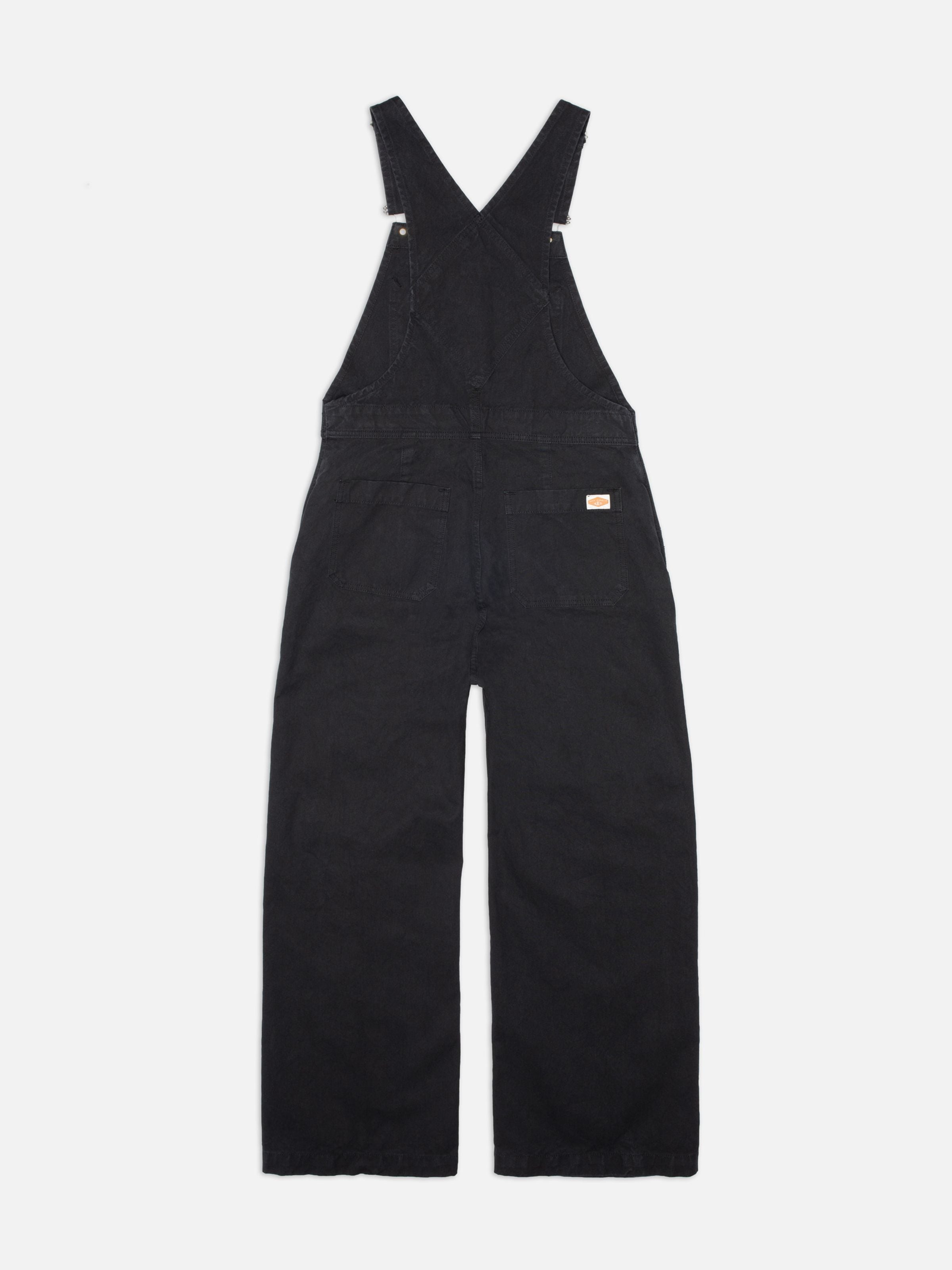 Nudie Jeans Klara Dungarees Duck Canvas in Black, shown from the back.