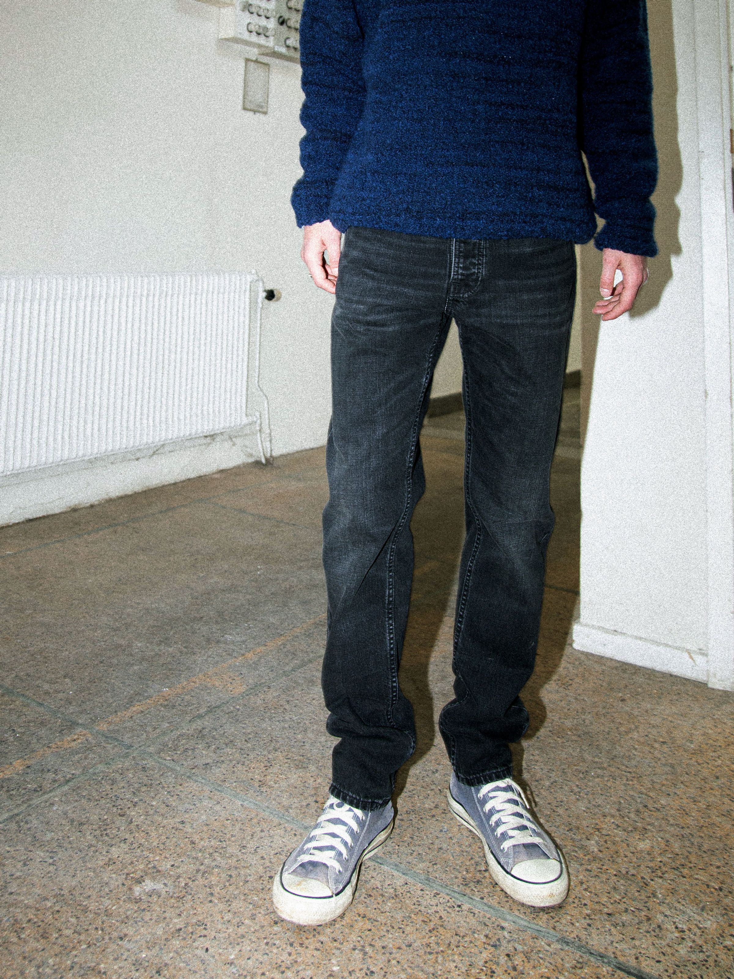 Nudie Jeans Steady Eddie II Black Fog, regular fit tapered jeans in organic cotton denim, shown from the waist down.