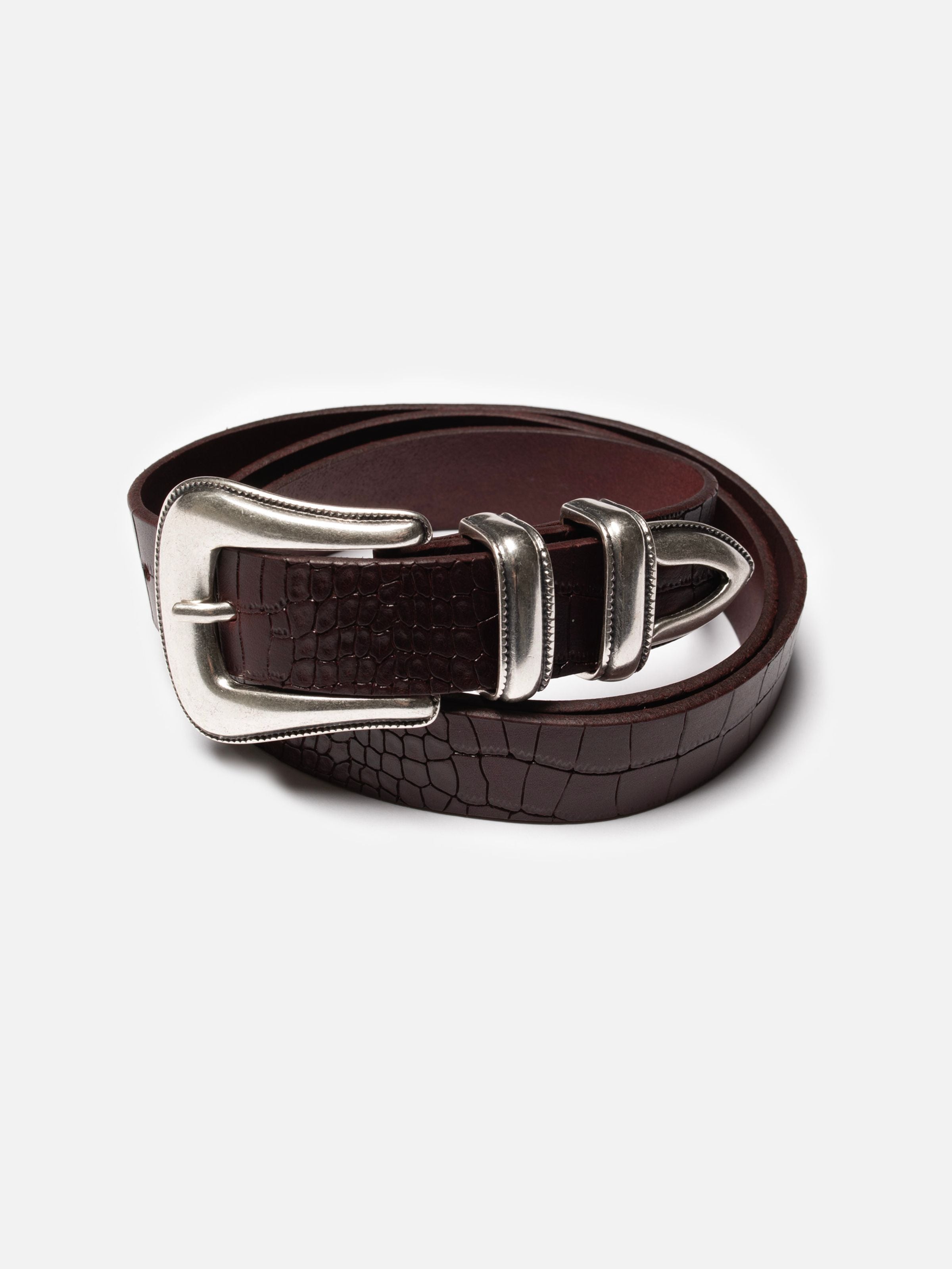 Nudie Jeans Western Faux Croco Silver Belt Burgundy, a rolled leather belt with crocodile embossing and silver hardware.