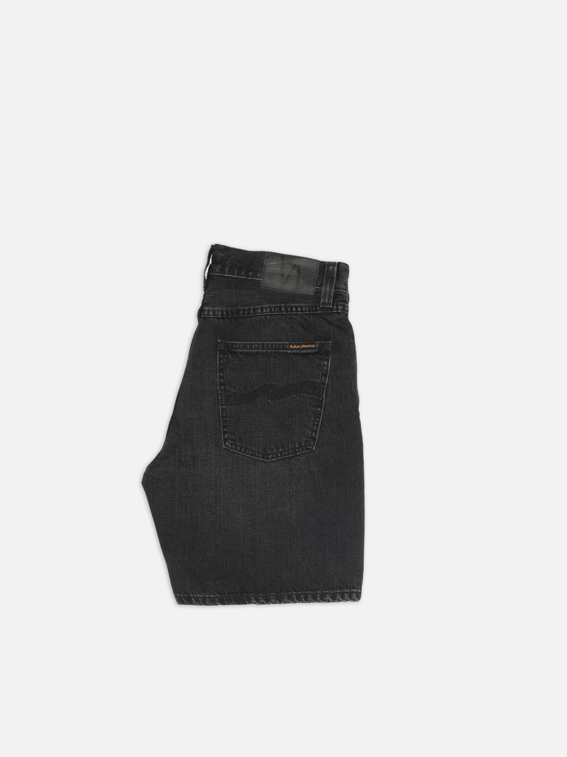Nudie Jeans Zeb Denim Shorts Night Dune, black denim shorts shown from the side on a white background.