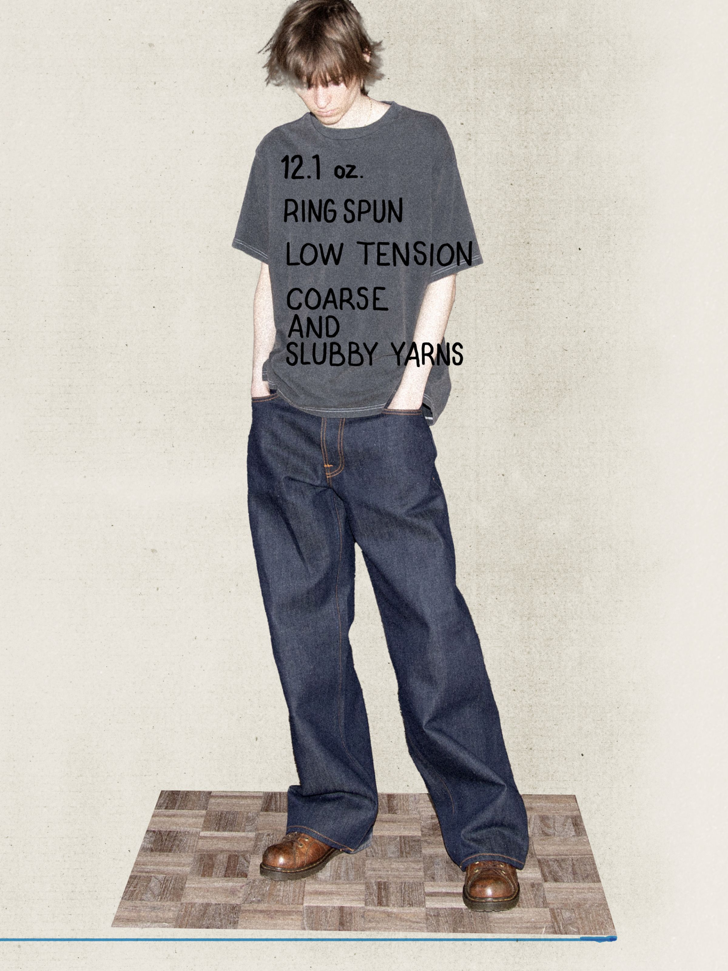 Nudie Jeans Loud Larry Dry Weird loose-fit wide-leg jeans in dry blue denim, shown from the front on a model.