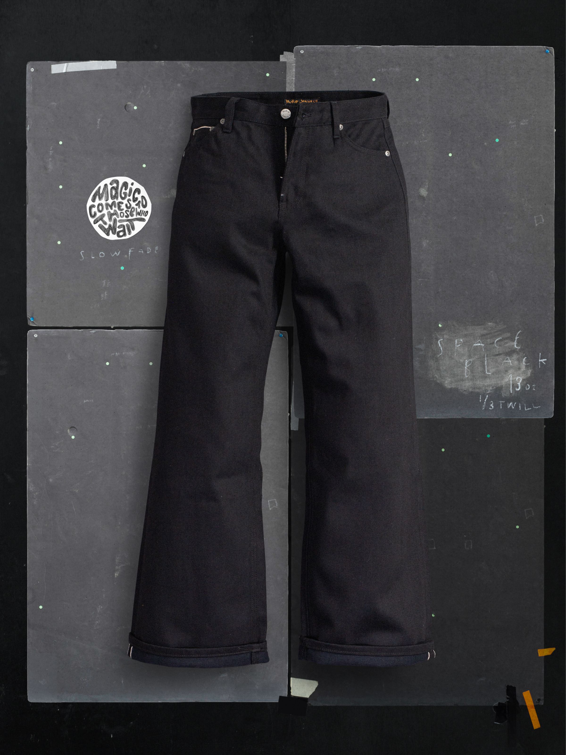 Nudie Jeans Wide Heidi Space Black Selvage, women's wide-leg jeans shown in a flatshot with selvedge cuff detail.