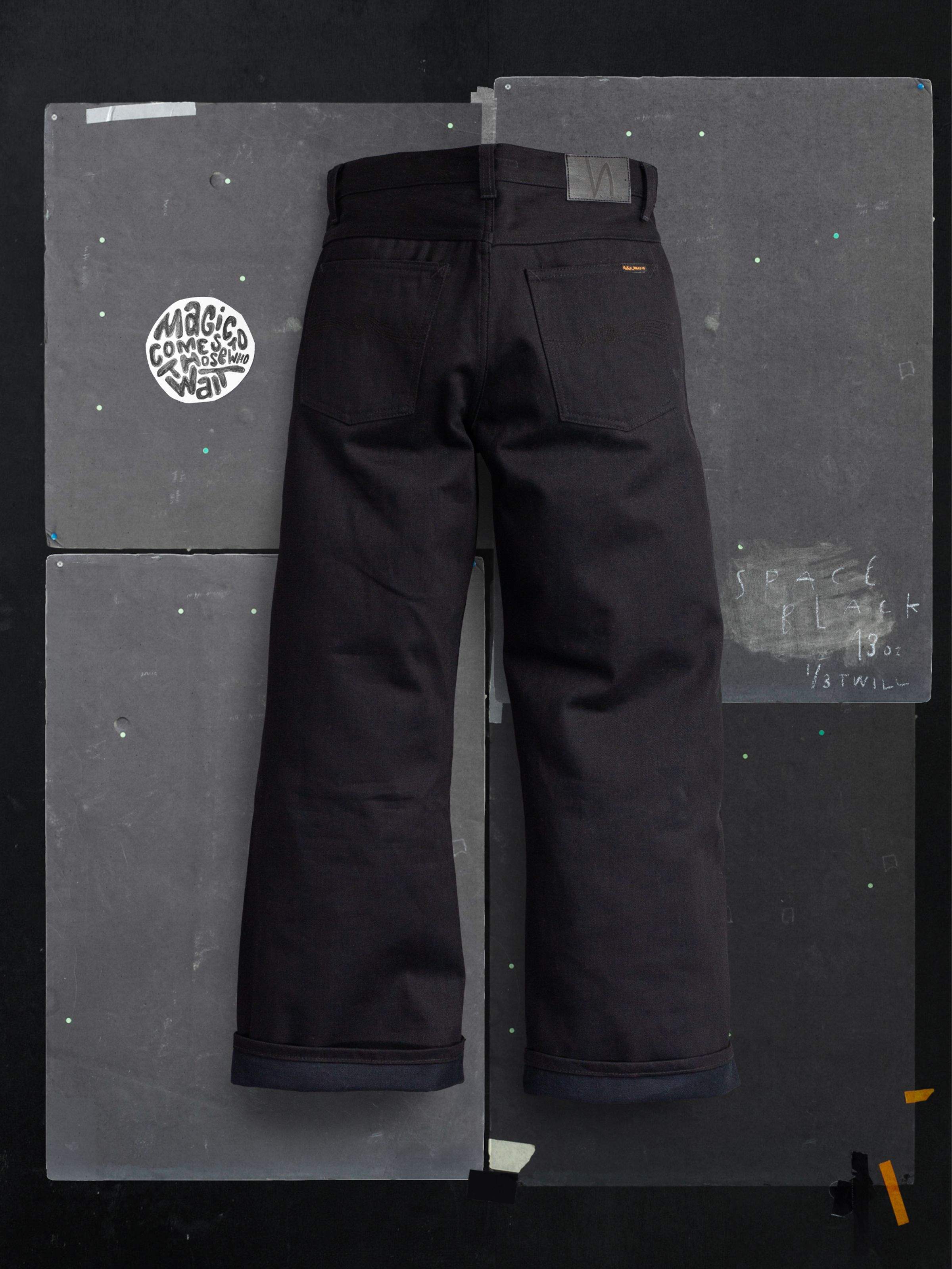 Nudie Jeans Loud Larry Space Black Selvage, wide-leg loose-fit jeans in rigid black selvedge denim, back view.