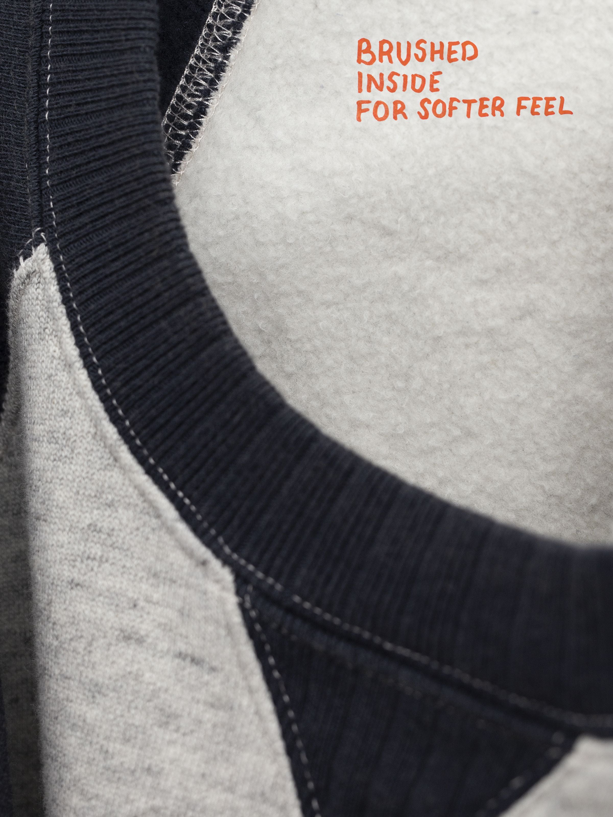Nudie Jeans Kaj Short Sleeve Embo Wave Greymelange, detail of the contrast ribbed neck and brushed organic cotton interior.