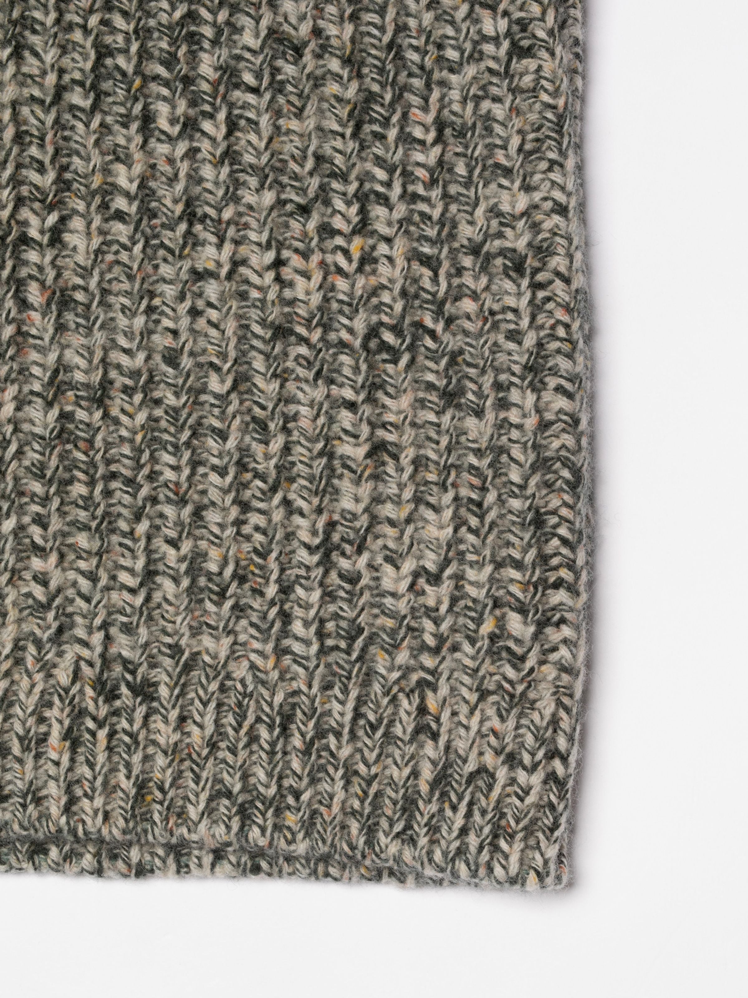 Nudie Jeans Gittan Sweater Chunky Knit in Green Melange, showing a close-up of the soft organic wool knit texture.
