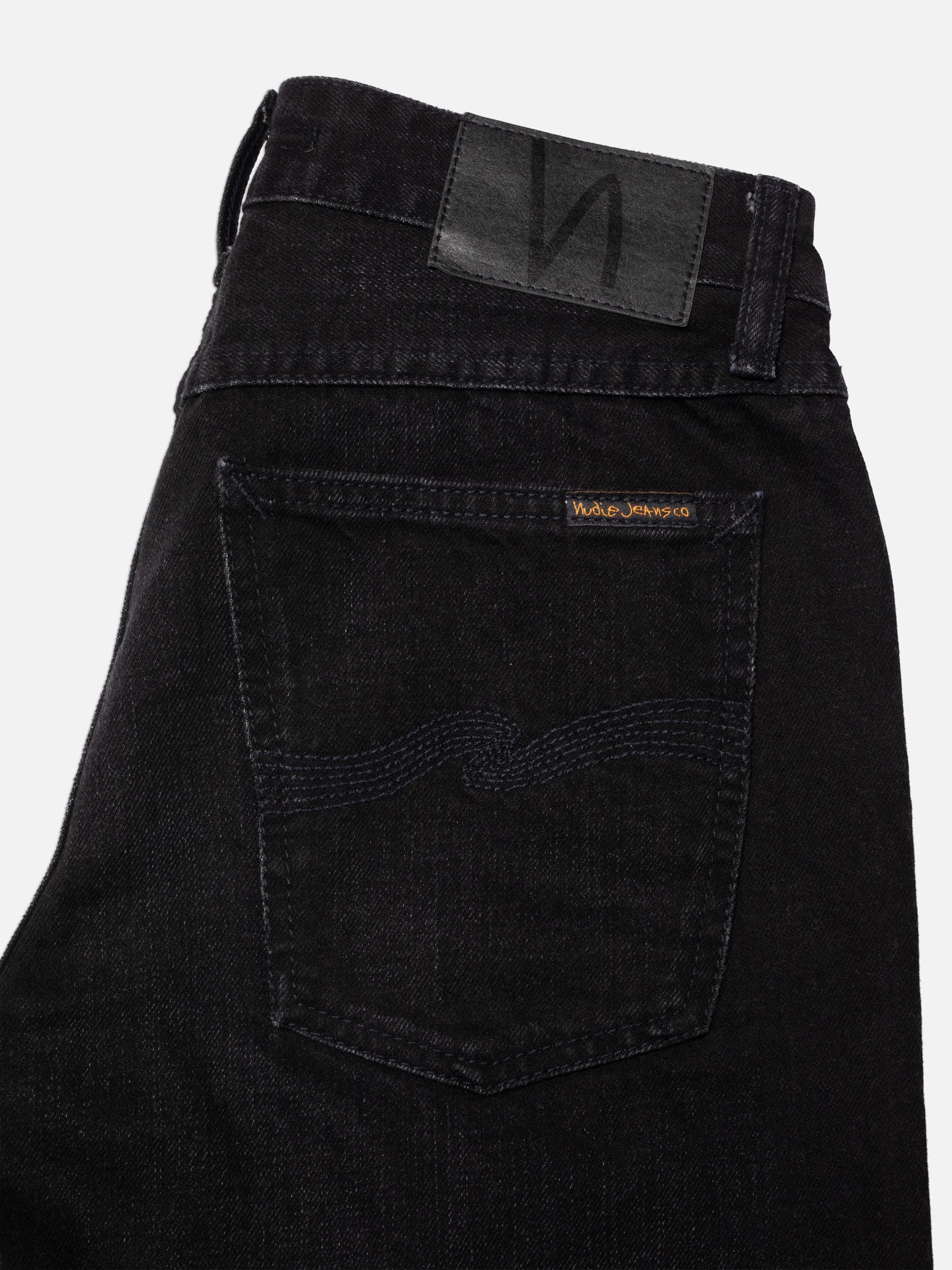 Nudie Jeans Sharp Charlie Midnight Ash, women's regular fit jeans, close-up of back pocket and black denim wash.