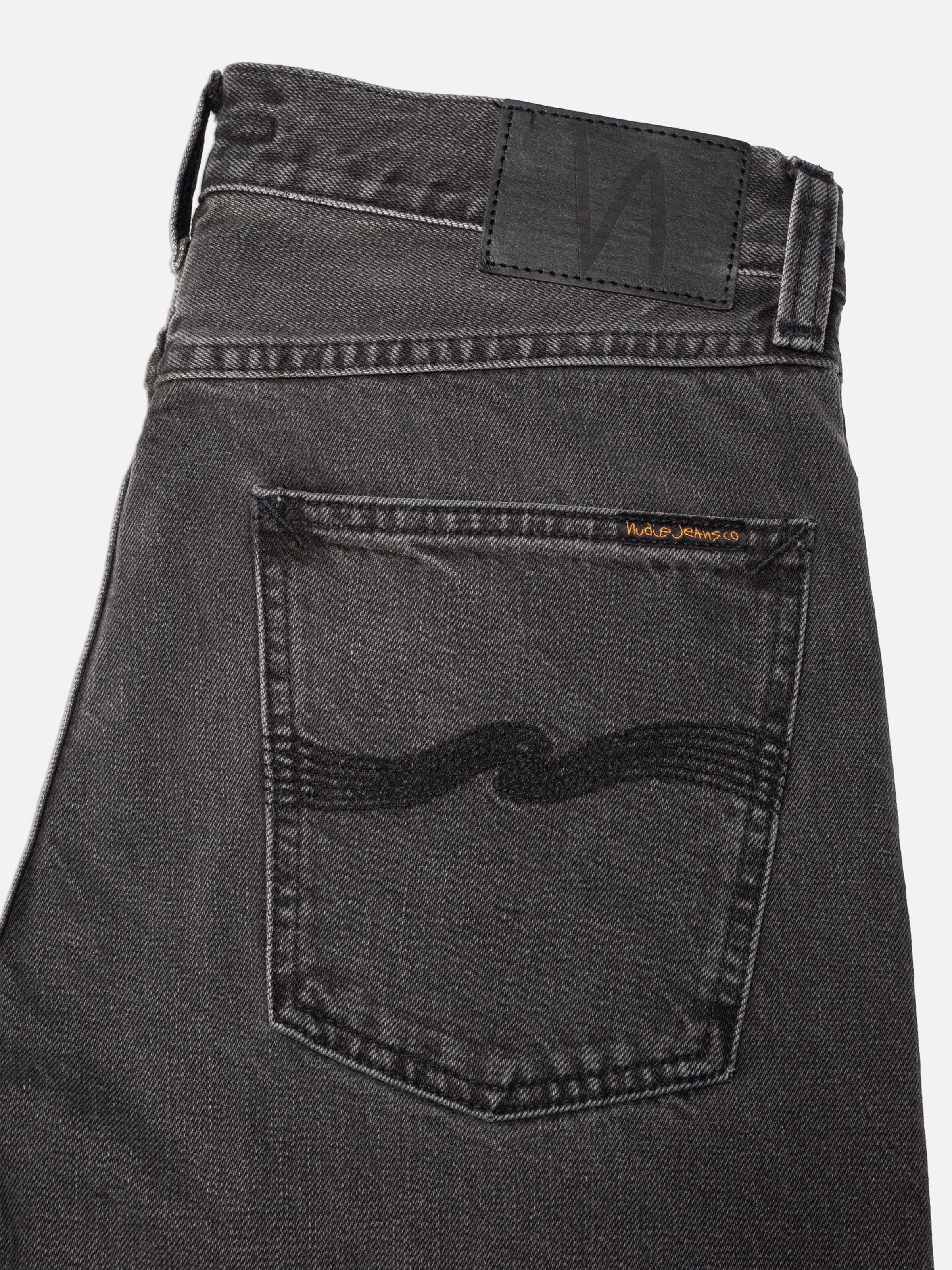 Nudie Jeans Rad Rufus Grey Lake, regular fit jeans, showing a close-up of the back pocket and washed grey denim texture.