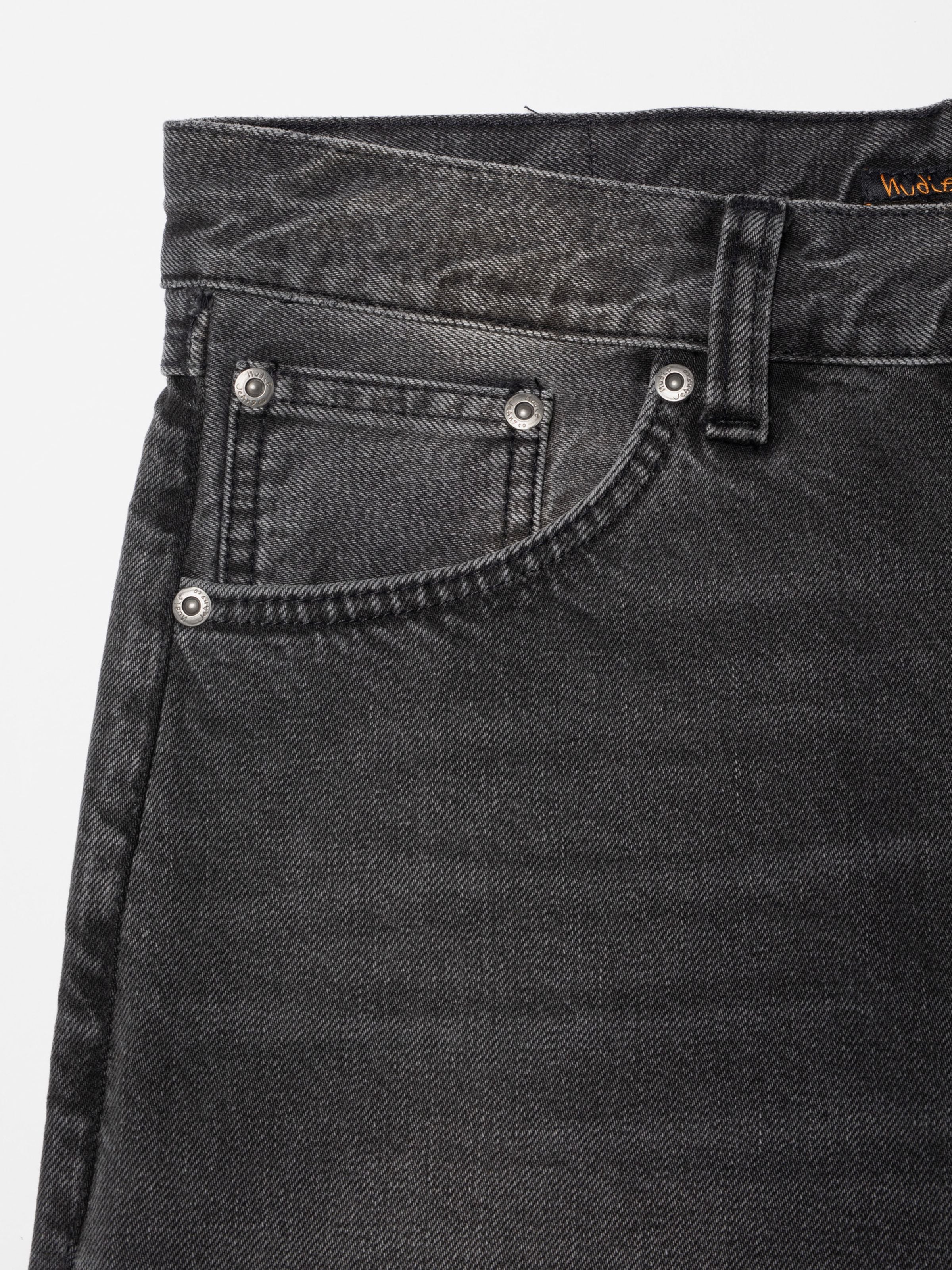Nudie Jeans Rad Rufus Grey Lake, men's regular fit jeans, showing a close-up of the front pocket and washed denim texture.