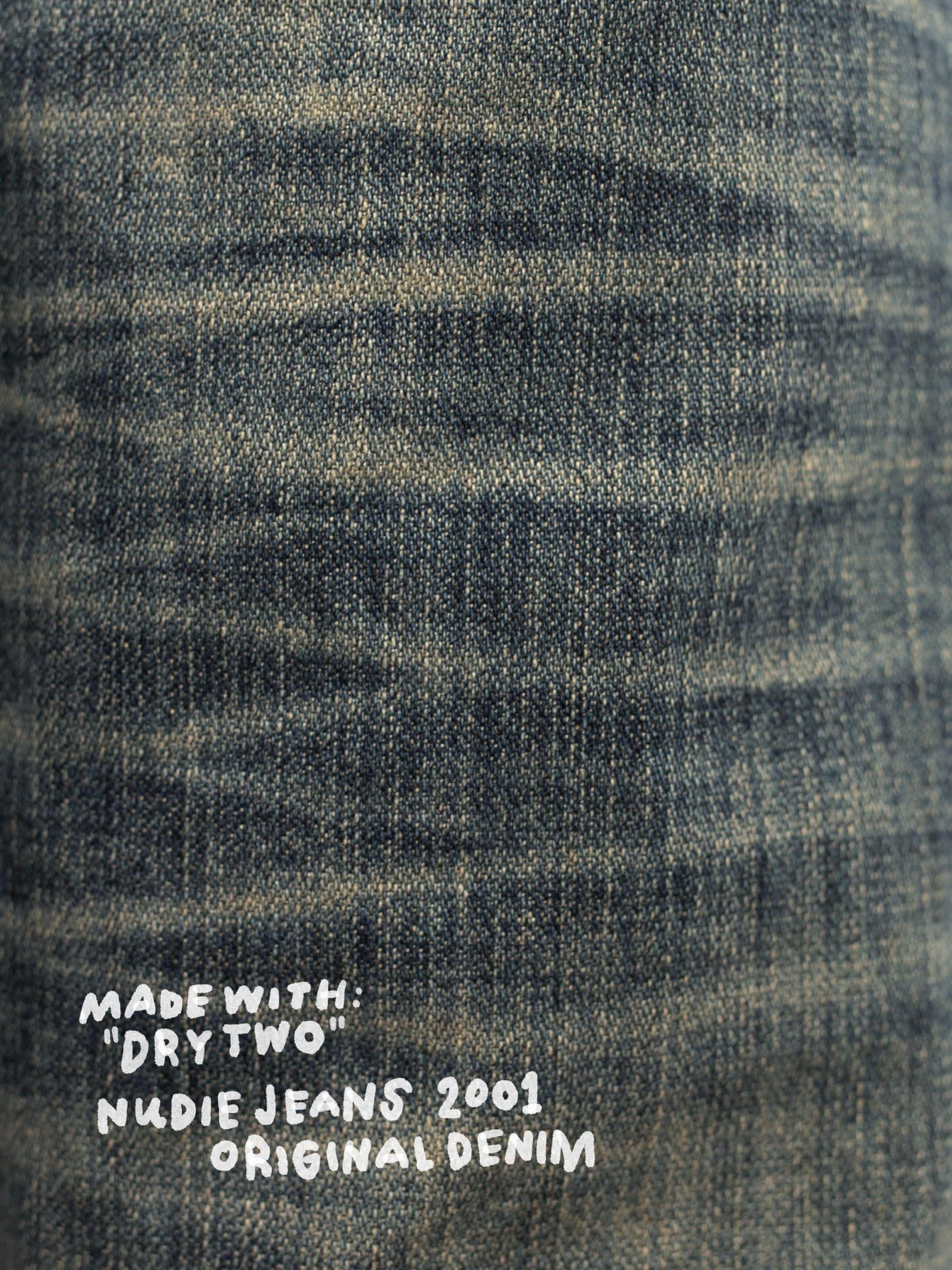 Nudie Jeans Steady Eddie II Quarter Tracks, close-up of the washed denim texture and dark blue hue.
