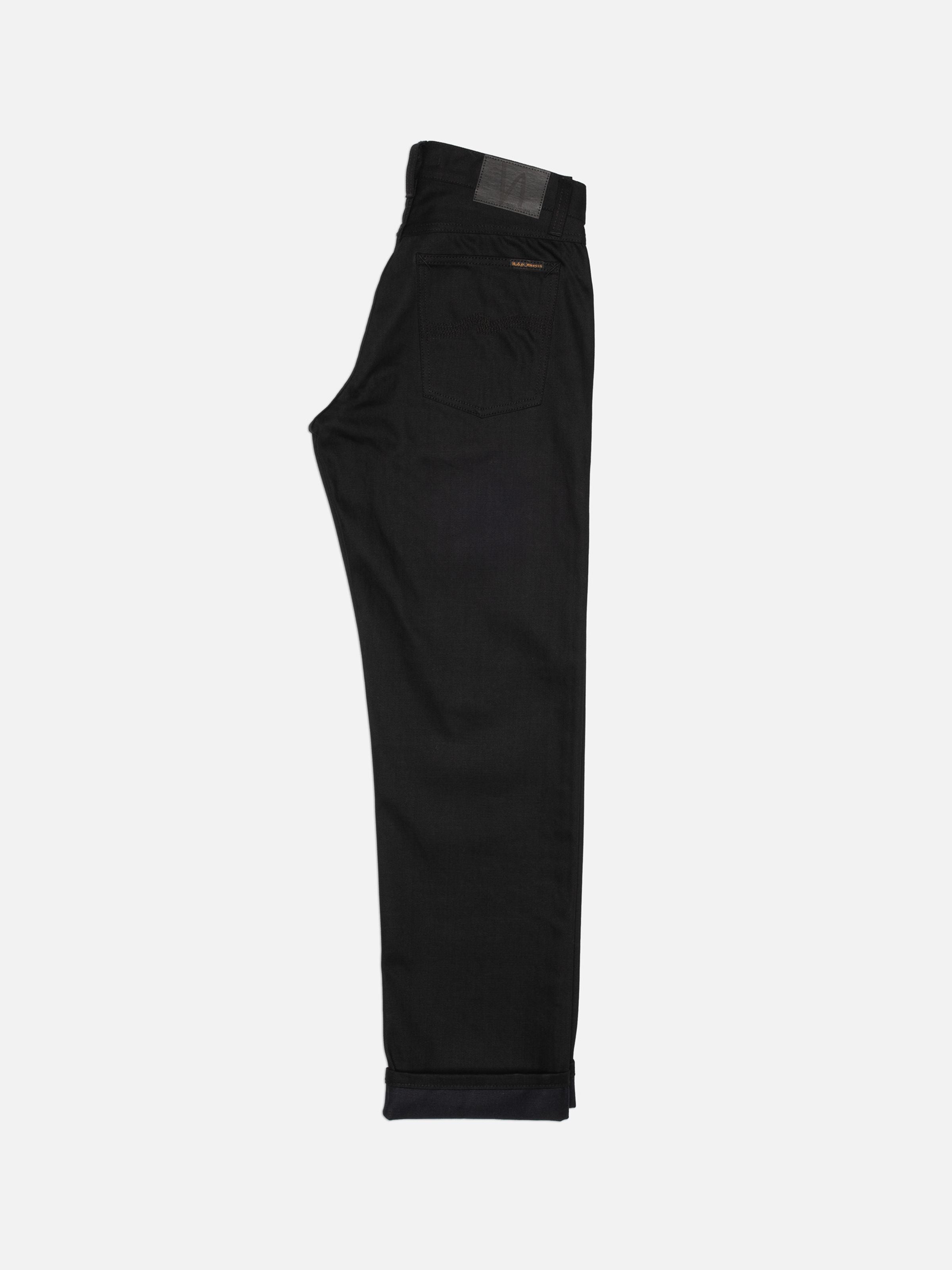 Nudie Jeans Rad Rufus Space Blk Selv, rigid regular-fit selvedge jeans shown from the back against a white background.