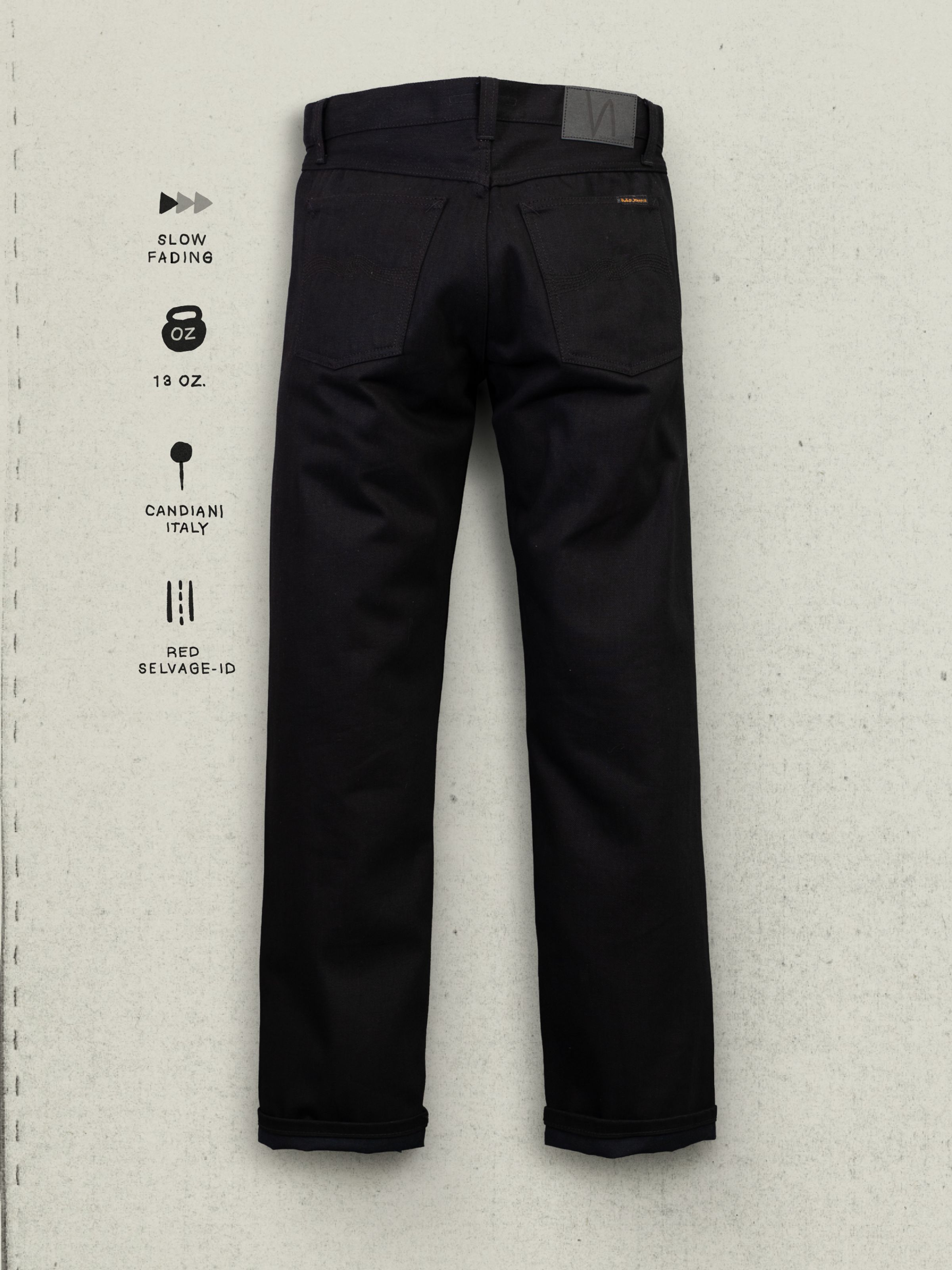 Nudie Jeans Rad Rufus Dry Space Black Selvage, back view of the black organic cotton selvedge denim jeans and back pockets.