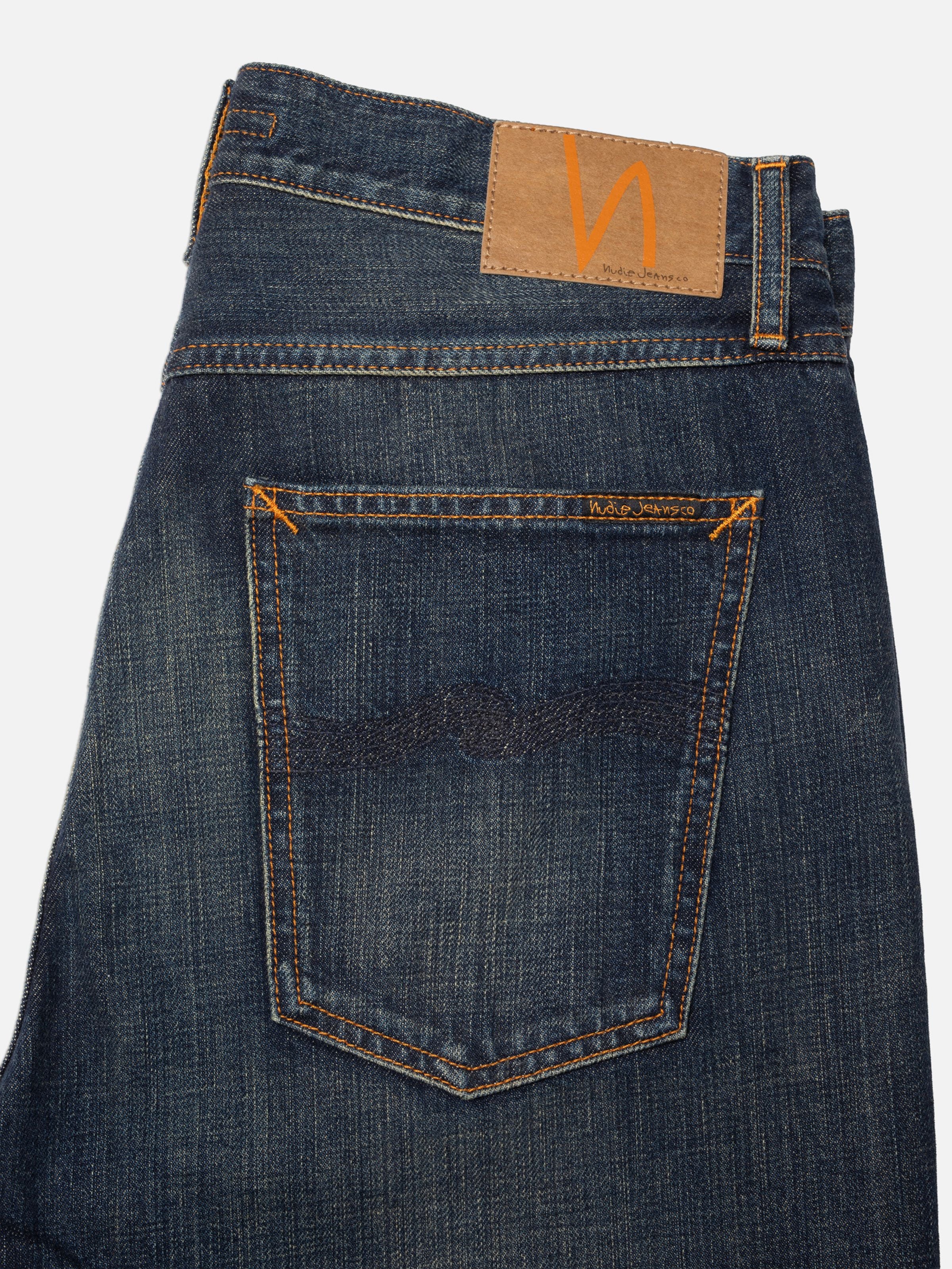 Nudie Jeans Tuff Tony Dirt Path, showing the back pocket, jacron patch, and indigo denim texture.