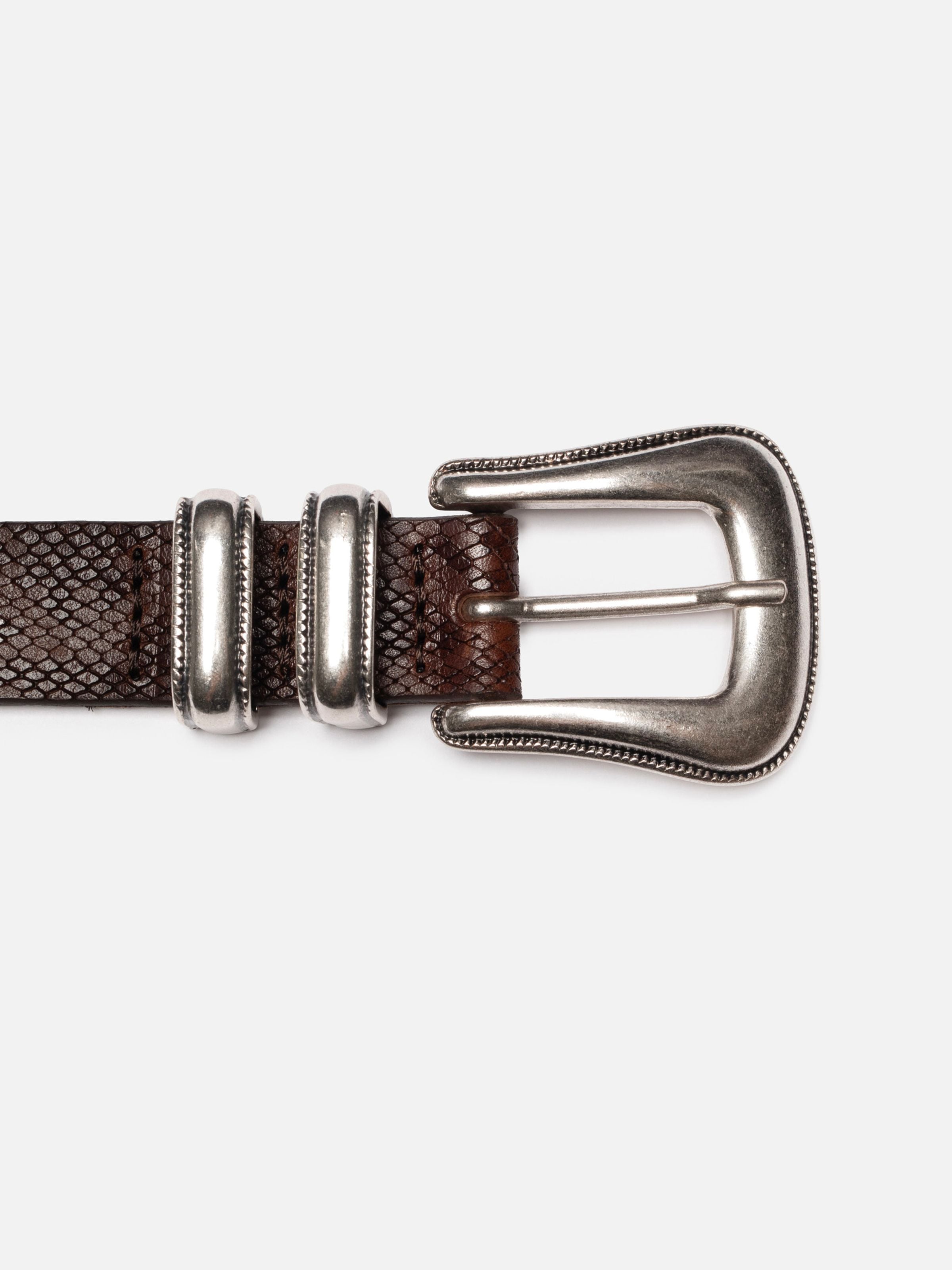 Nudie Jeans Western Faux Snake Silver Belt, close-up of the antique silver buckle.