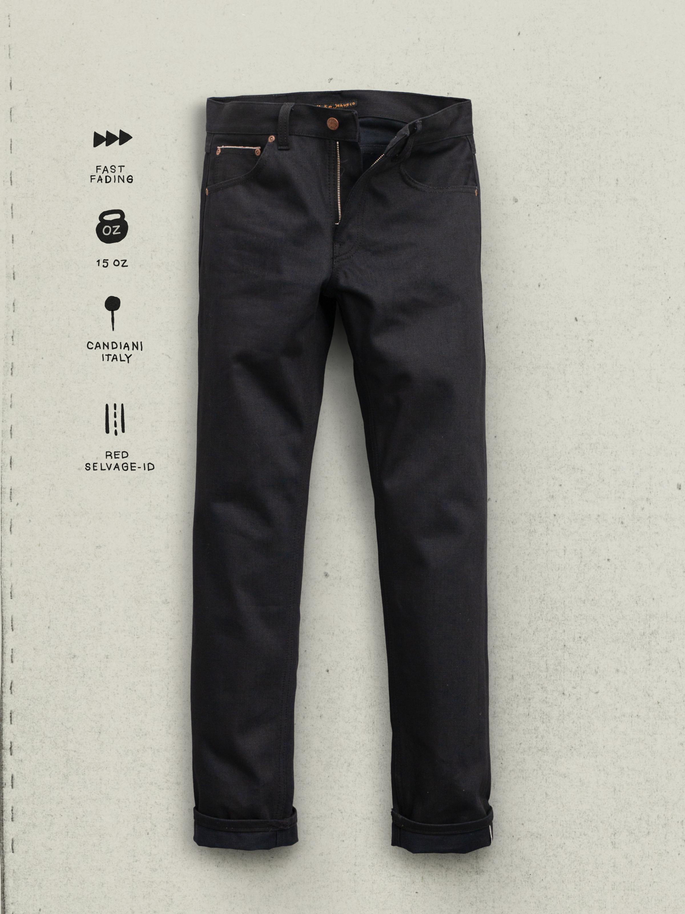 Nudie Jeans Gritty Jackson Dry Onyx Selvage, Vorderansicht mit schwarzem Denim, Kupferdetails und Reißverschluss.