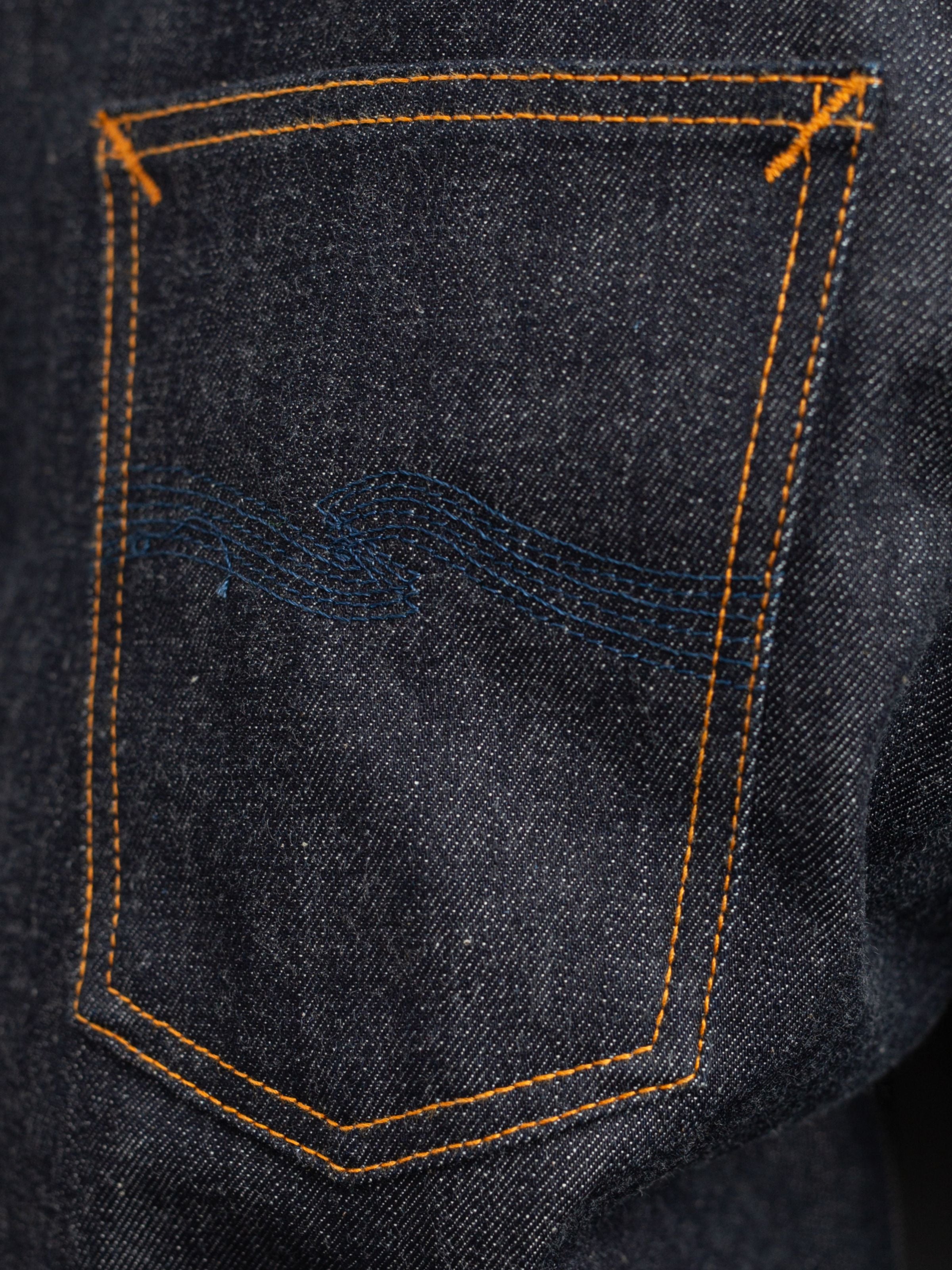 Solid Ollie Dry Apex Selvage jeans, close-up of back pocket and navy embroidery.