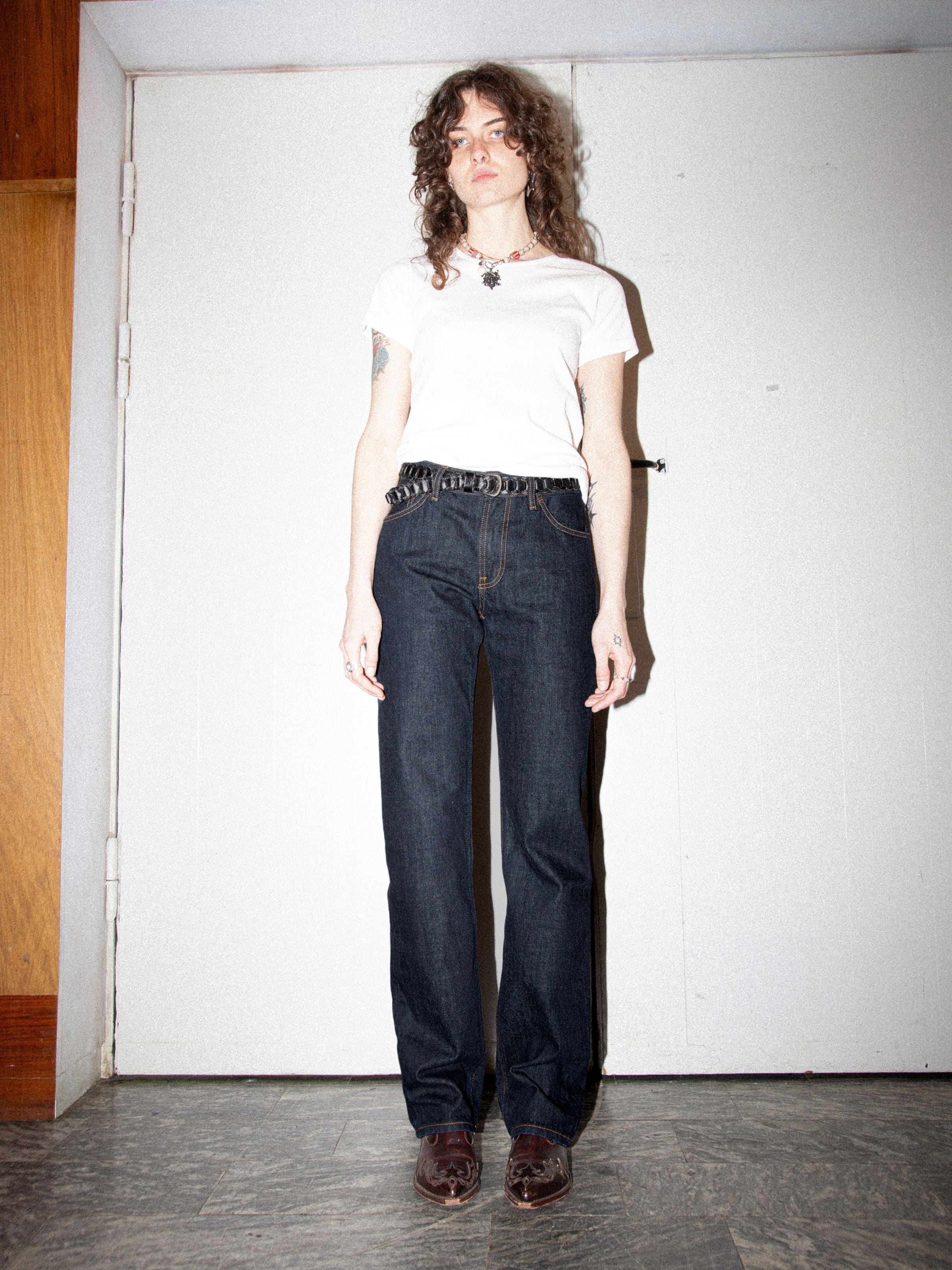 Nudie Jeans Sharp Charlie Blue One Wash, women's regular fit jeans in dark blue organic cotton, worn on model.
