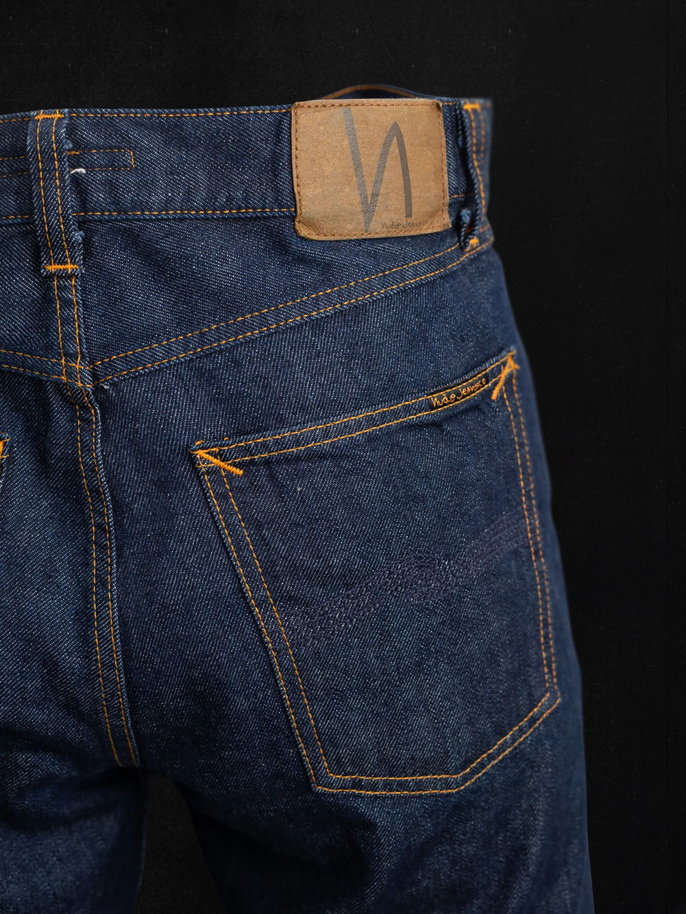 Nudie Jeans Rad Rufus Dusk Selvage, showing back pocket, jacron patch, and orange stitching.