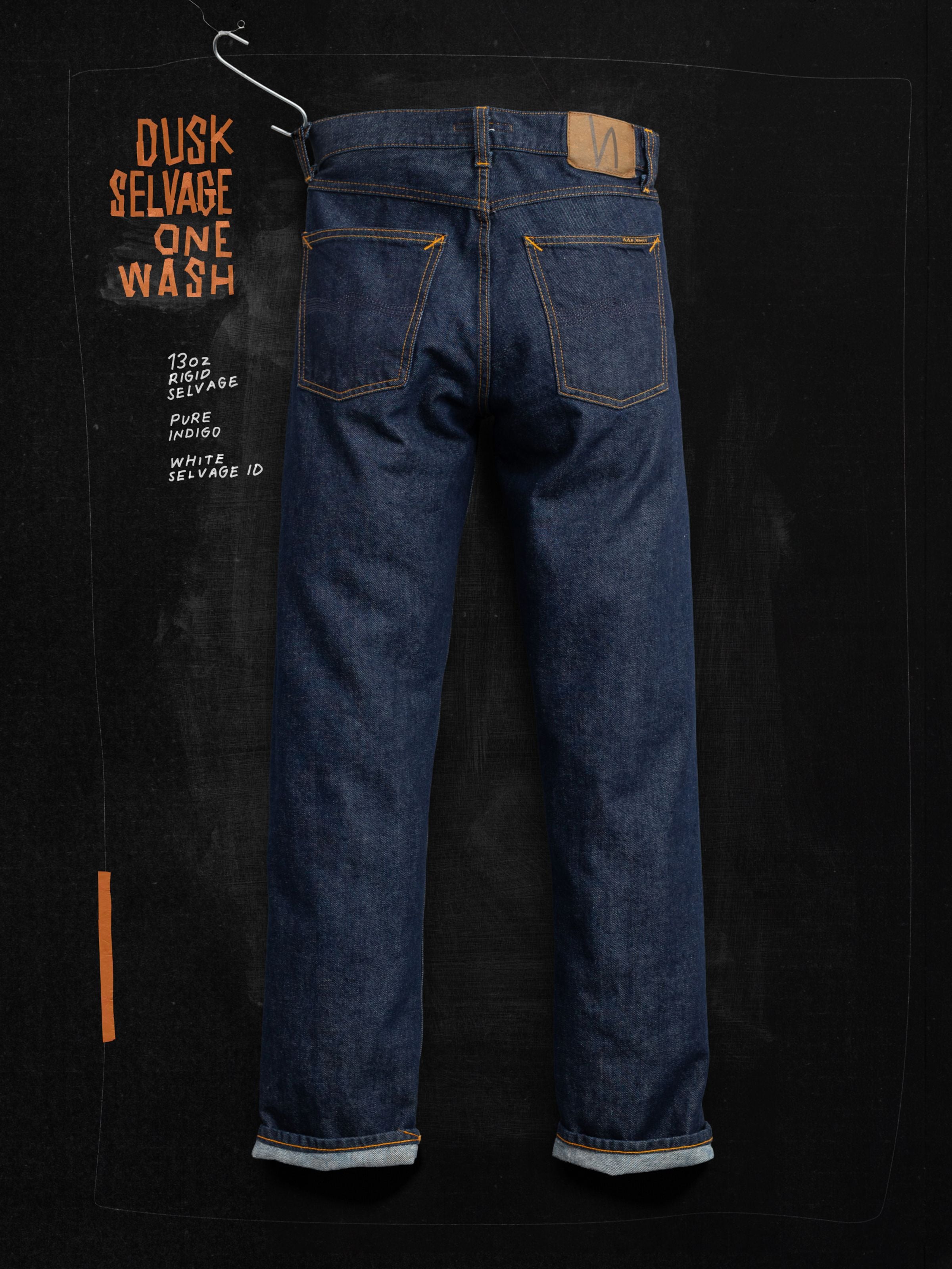 Nudie Jeans Rad Rufus Dusk Selvedge One Wash, men's high-waist regular fit jeans from the back against a chalkboard.