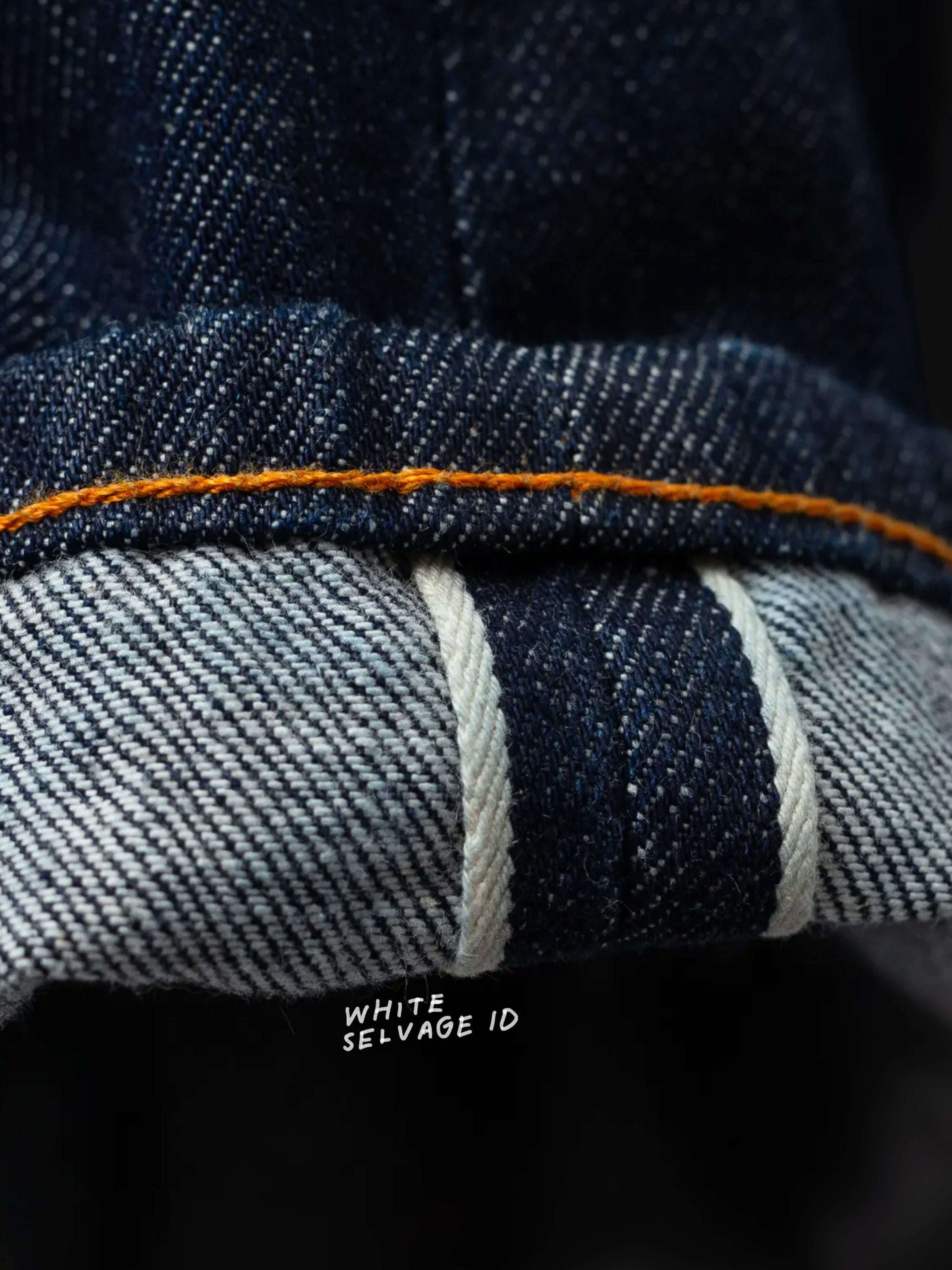 Nudie Jeans Gritty Jackson Dusk Selvage One Wash, close-up of the selvedge ID and denim fabric texture.