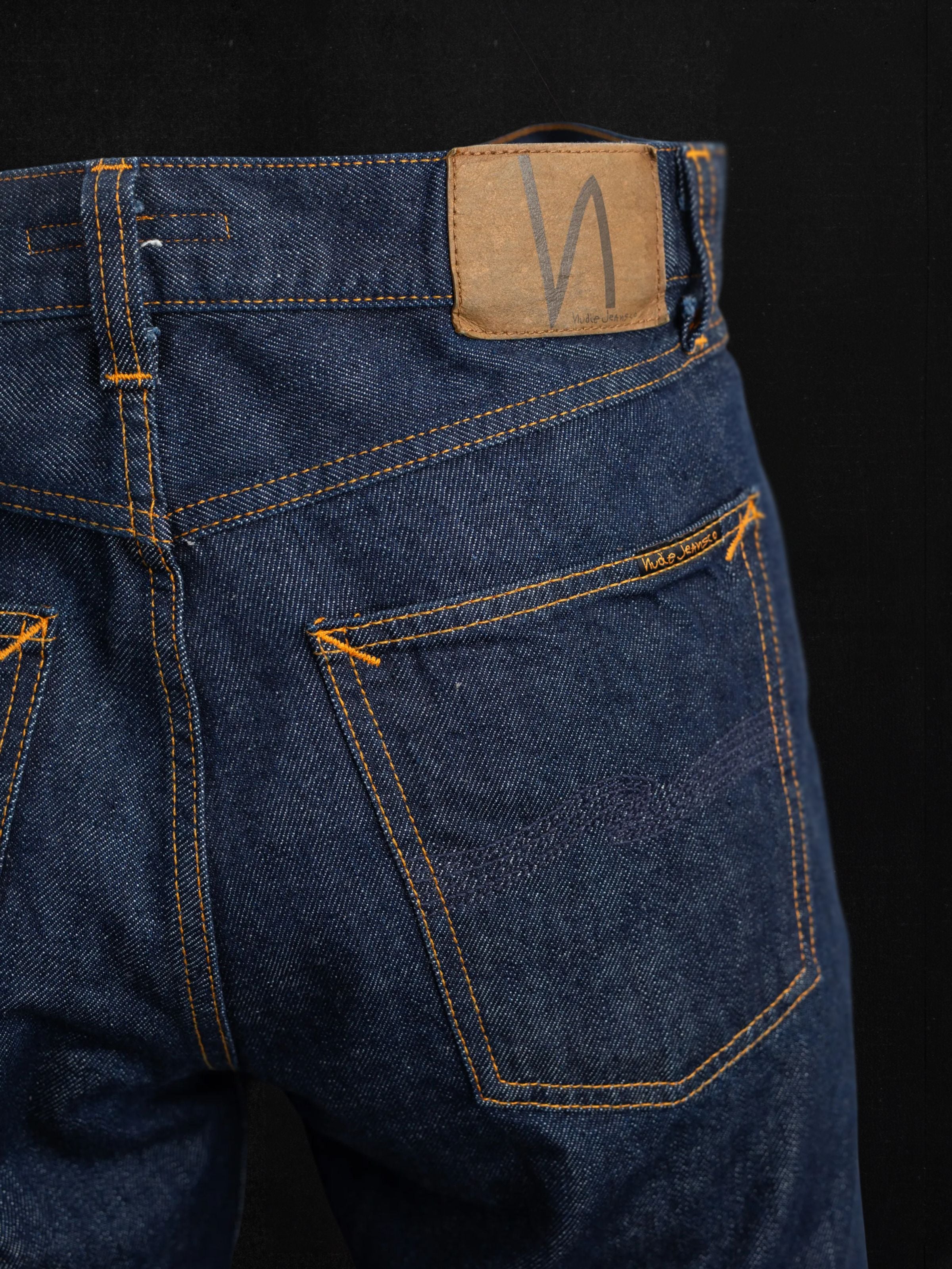 Nudie Jeans Gritty Jackson Dusk Selvage jeans in dark indigo, showing the back pocket and jacron patch.