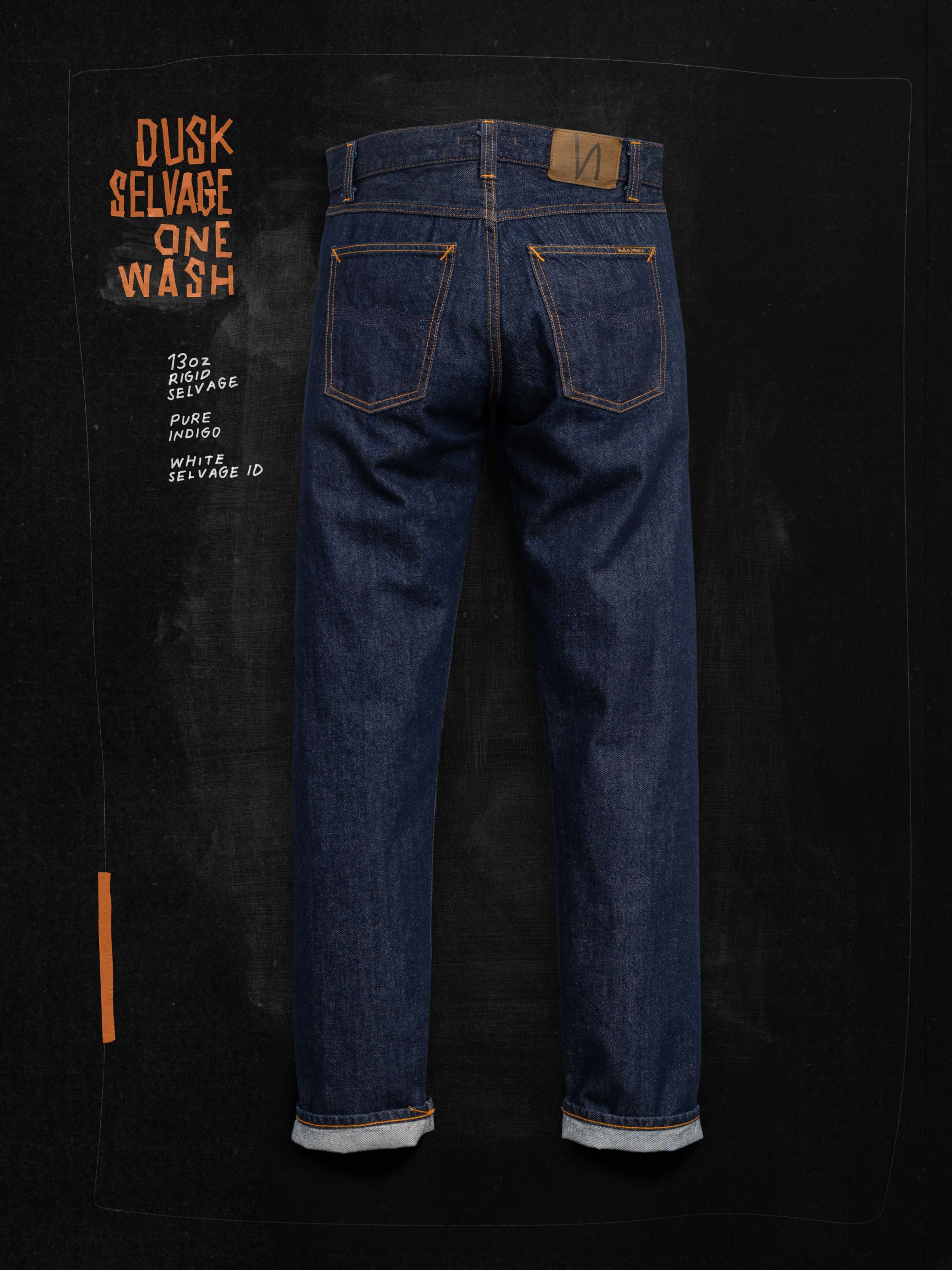 Nudie Jeans Gritty Jackson Dusk Selvedge One Wash jeans, shown in a flat shot of the back against a dark background.