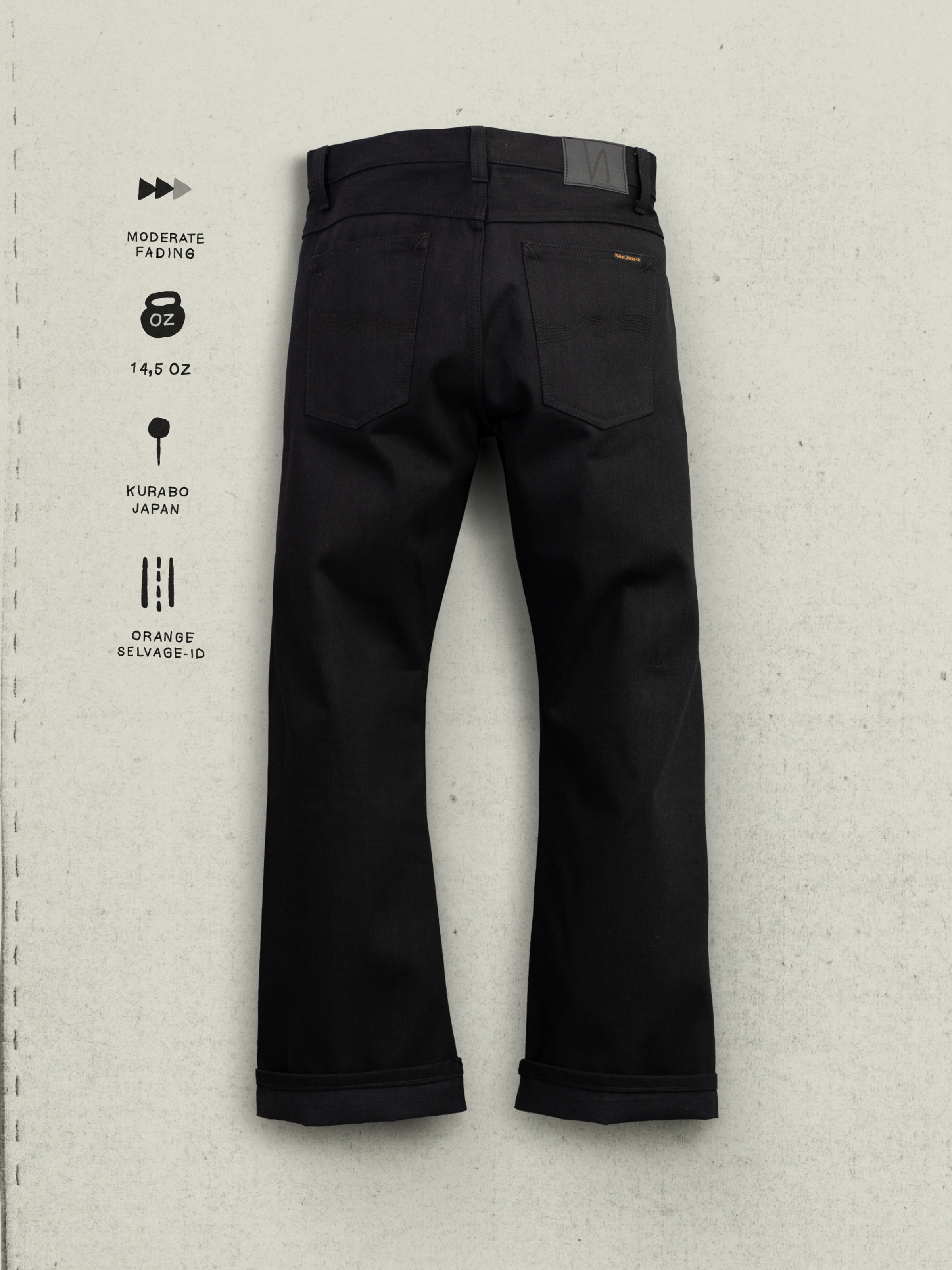 Nudie Jeans Regular Alf Dry Black Selvage, back view showing back pockets, jacron patch, and black denim wash.