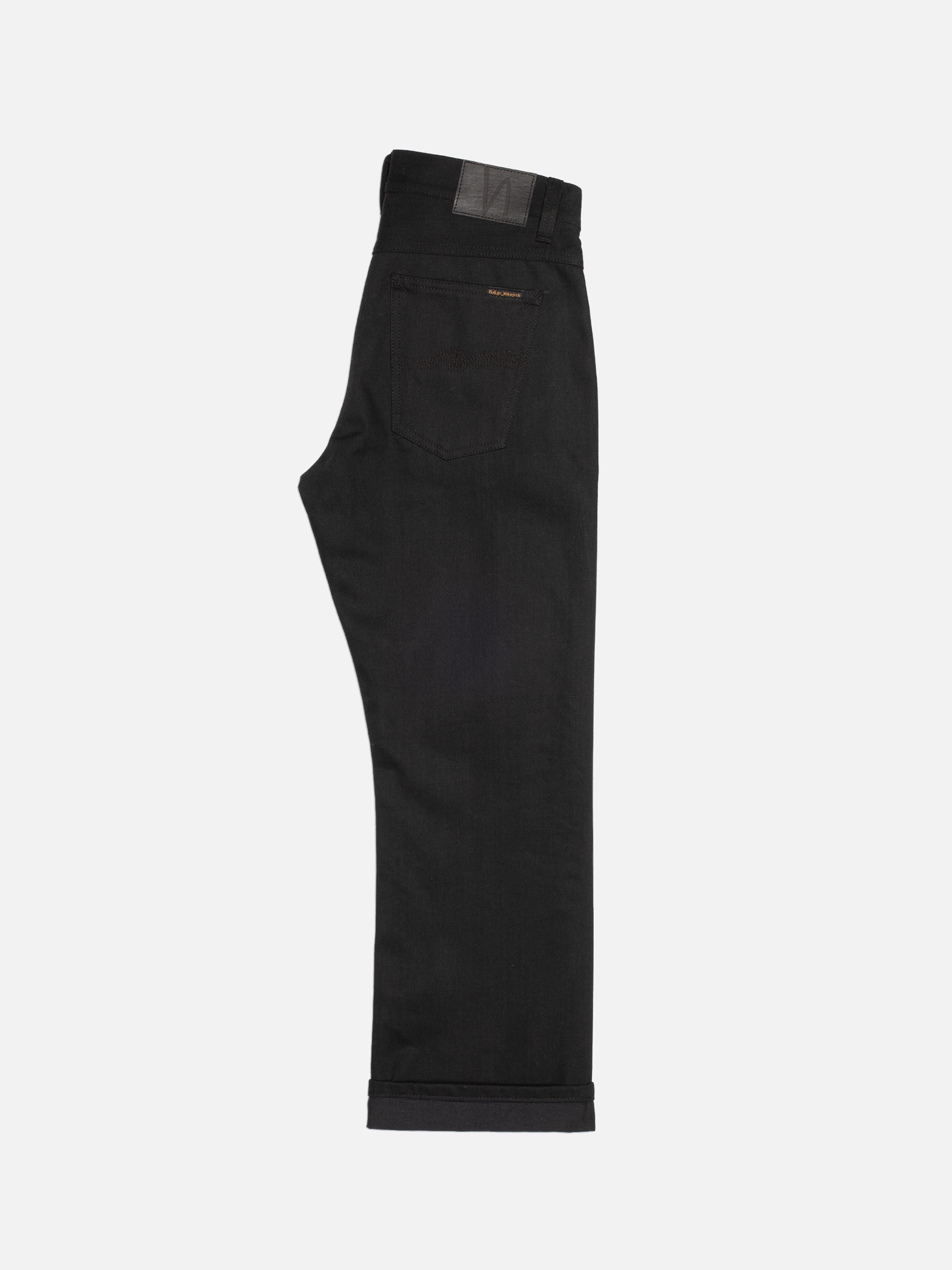 Nudie Jeans Regular Alf Dry Black Selvage, men's regular fit jeans shown in a rear view focusing on the black denim texture.